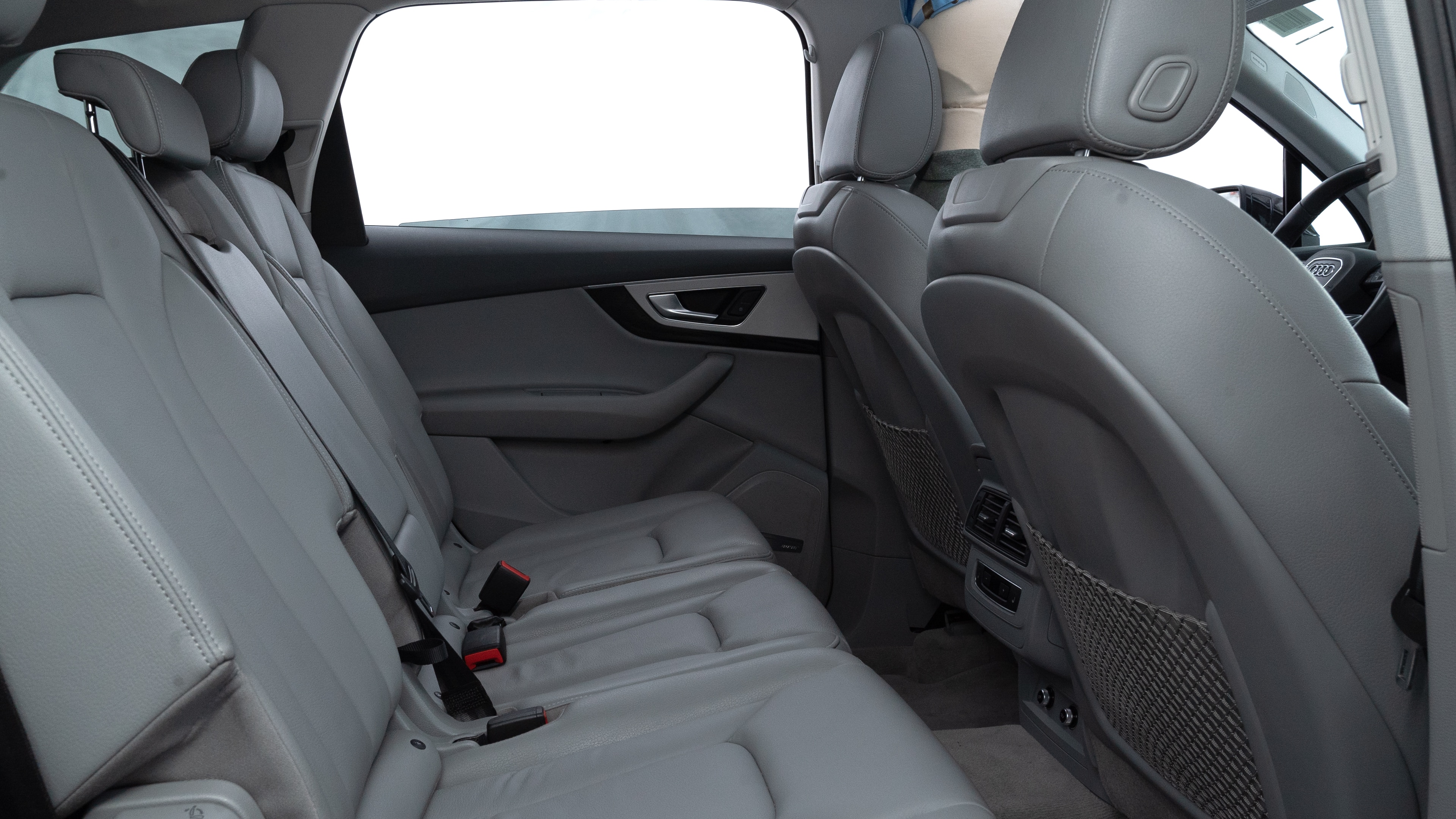 A series of second-row backseat photos is shown including one seating a baby seat and one seating a 6'1" mannequin.