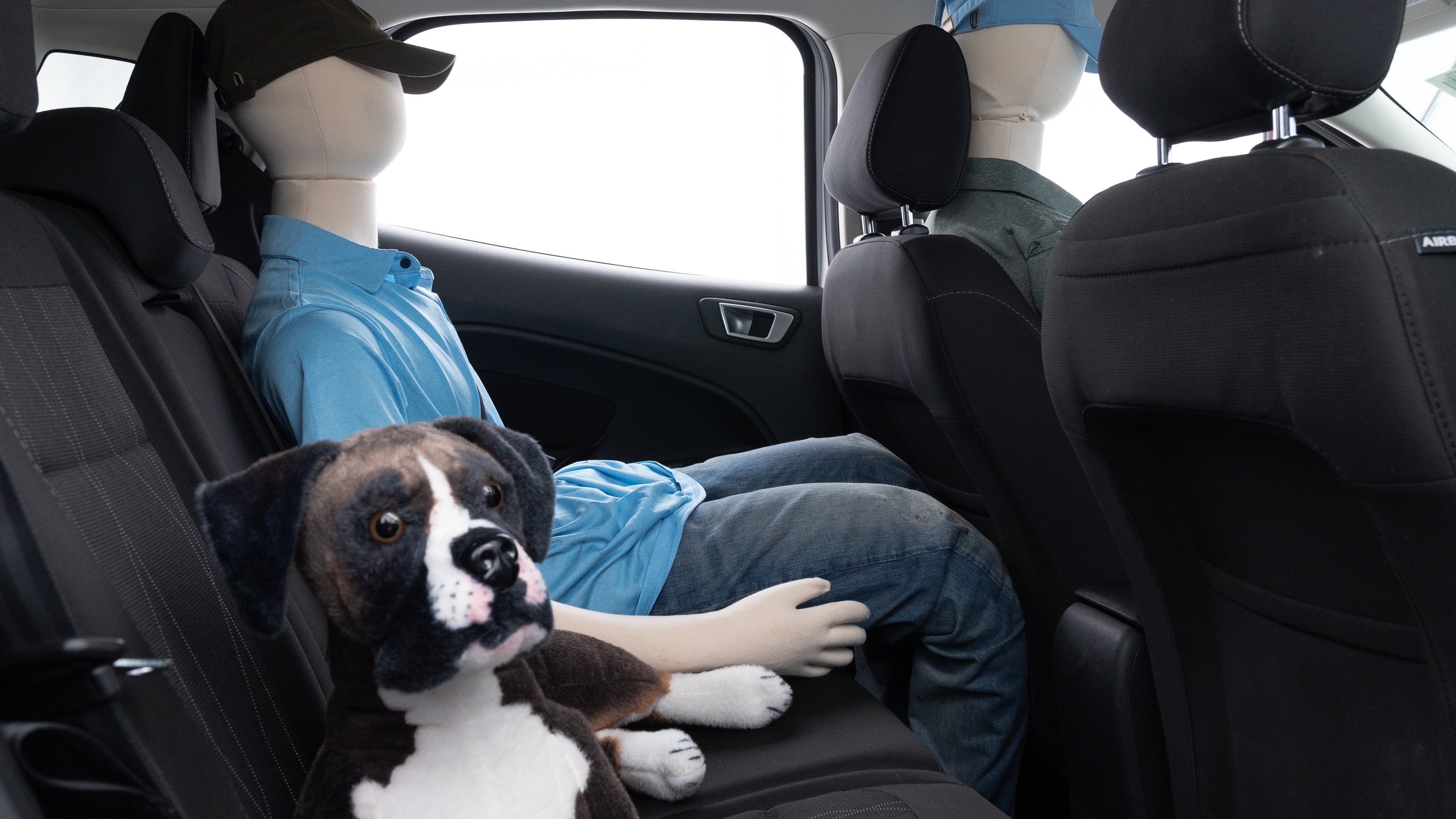 A series of second-row backseat photos is shown including one seating a baby seat and one seating a 6'1" mannequin.