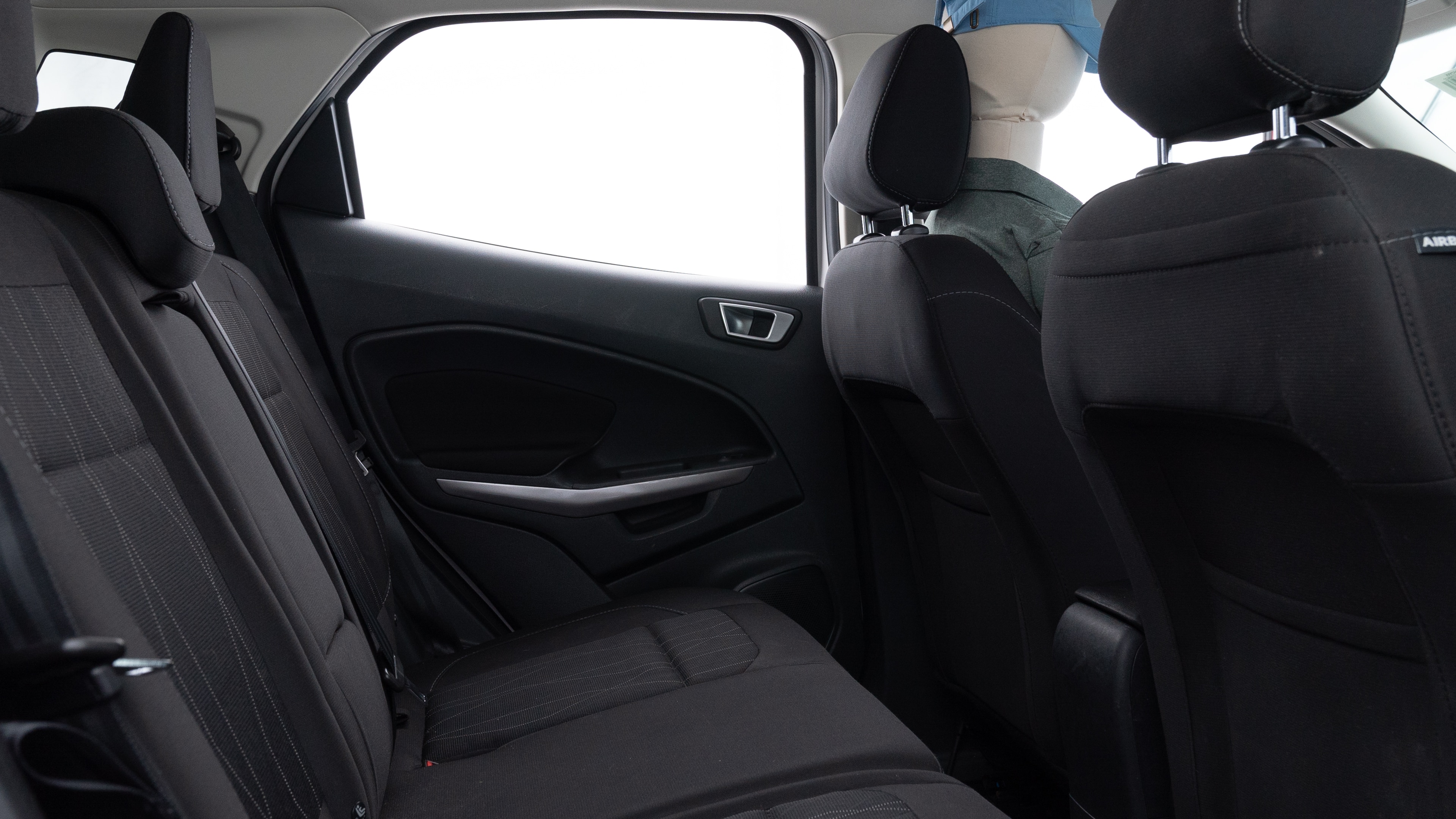 A series of second-row backseat photos is shown including one seating a baby seat and one seating a 6'1" mannequin.