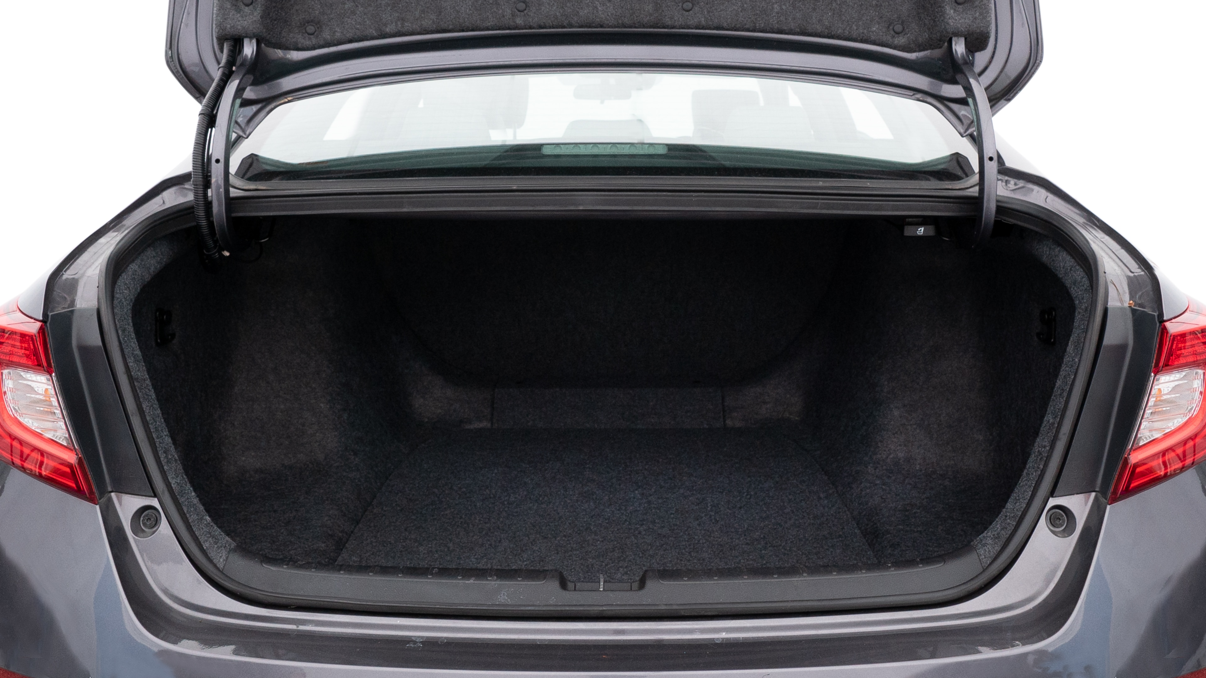 The trunk lid is open showing full view of the trunk. A baby stroller, three grocery carriers, two camping chairs in the carrying bag, and a set of golf clubs are placed inside.