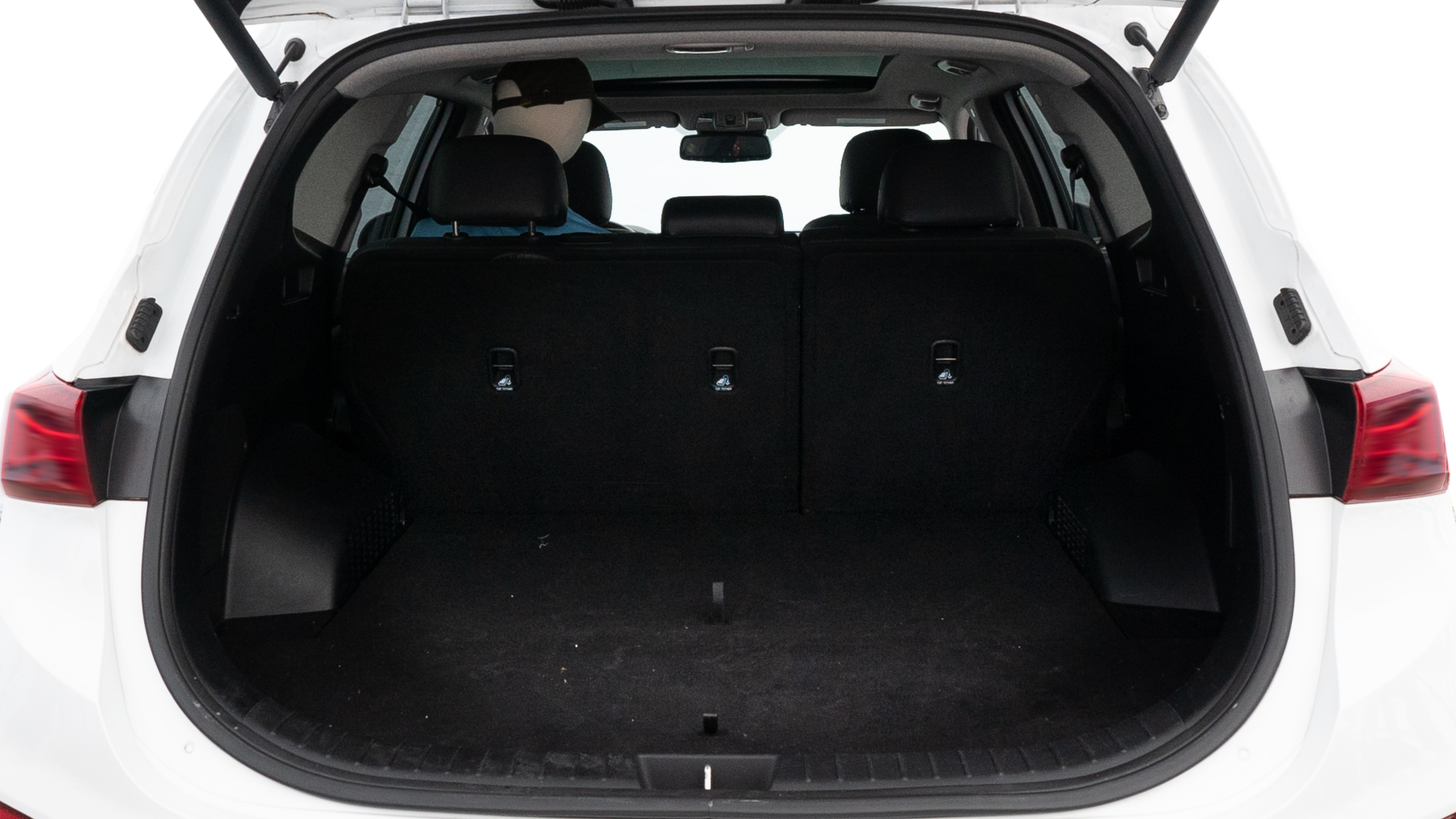 The trunk lid is open showing full view of the trunk. A baby stroller, three grocery carriers, two camping chairs in the carrying bag, and a set of golf clubs are placed inside.