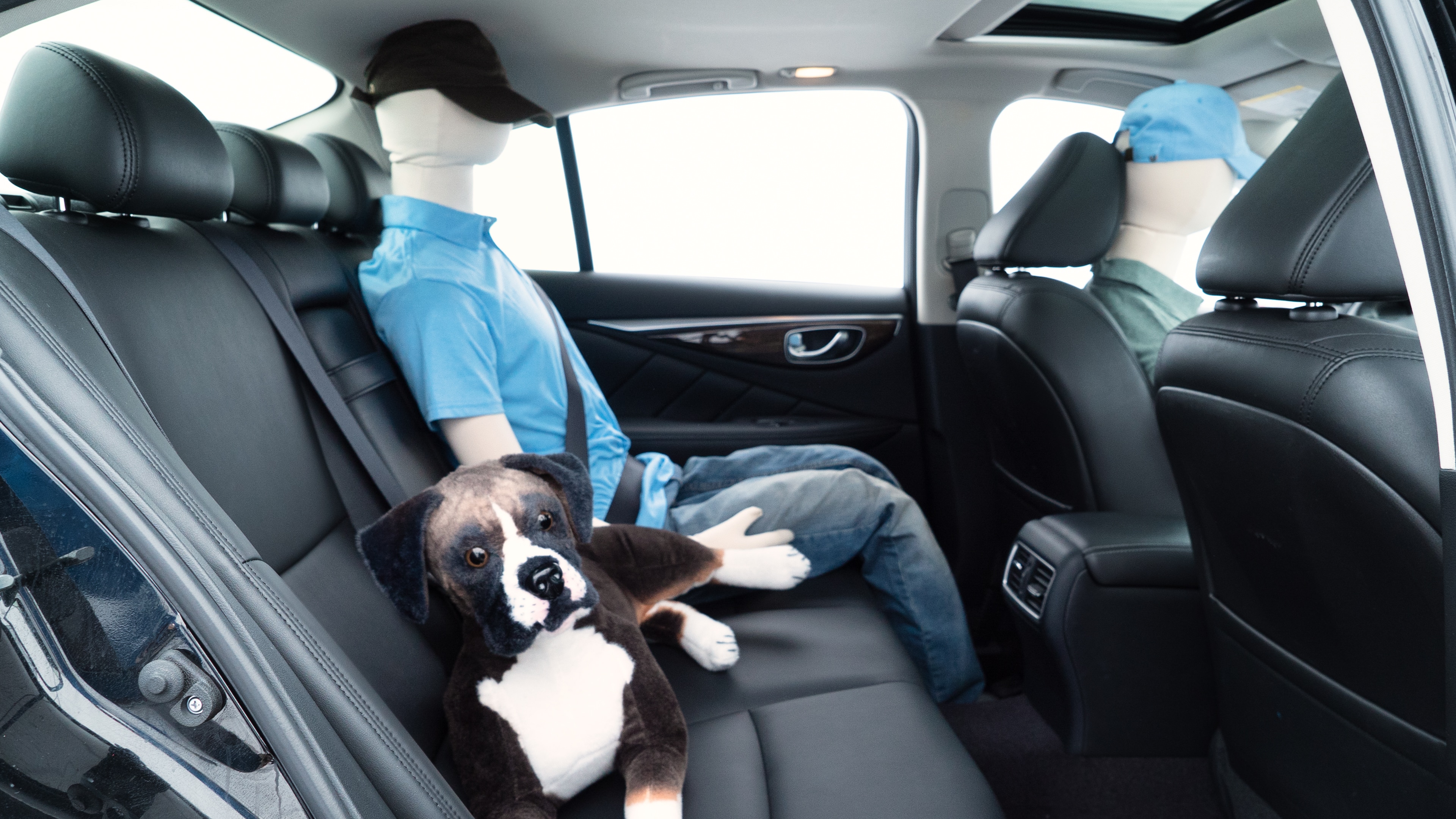 A series of second-row backseat photos is shown including one seating a baby seat and one seating a 6'1" mannequin.