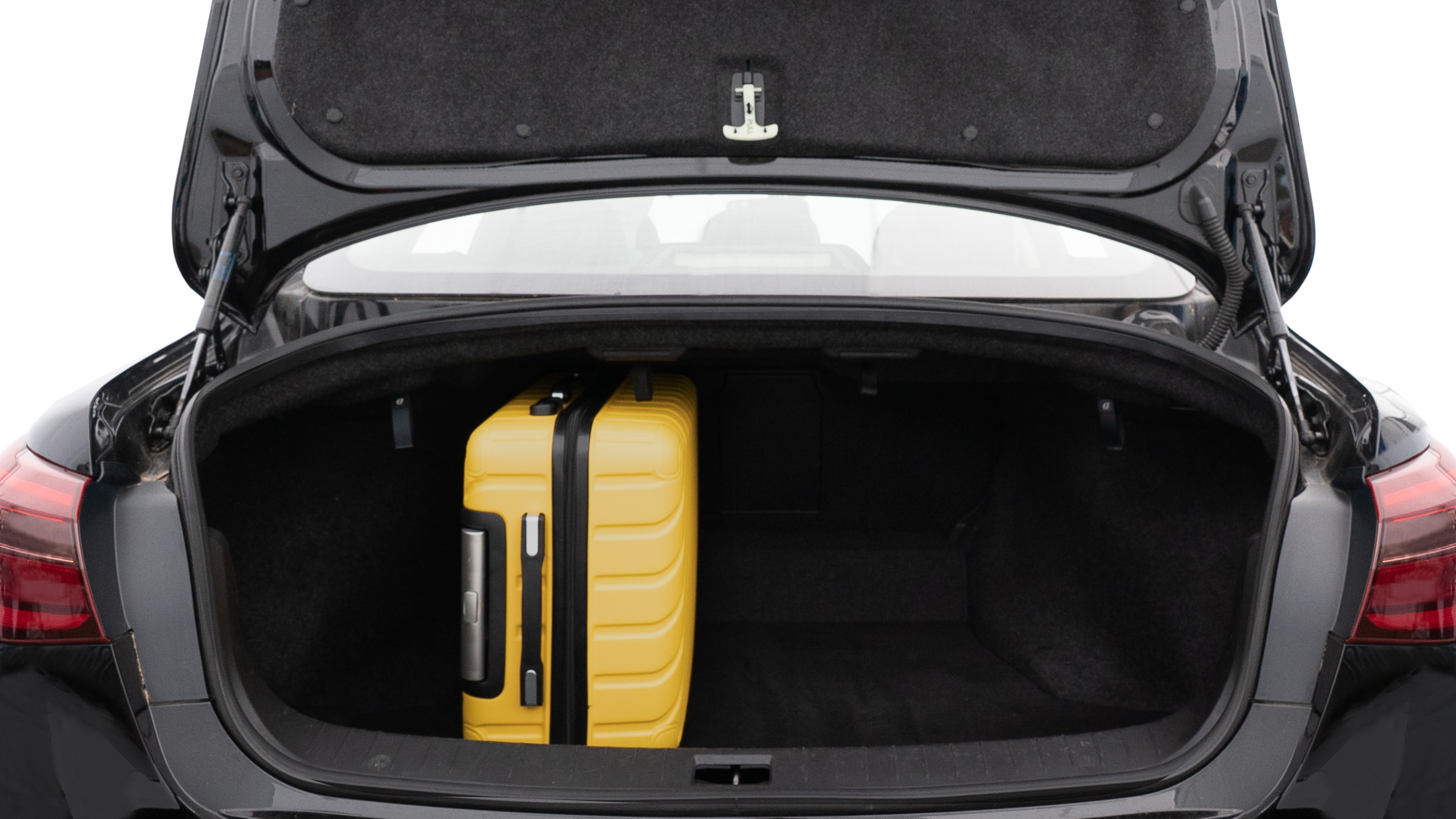 The trunk lid is open, showing full view of the trunk space. Two medium and one small suitcase are placed inside.