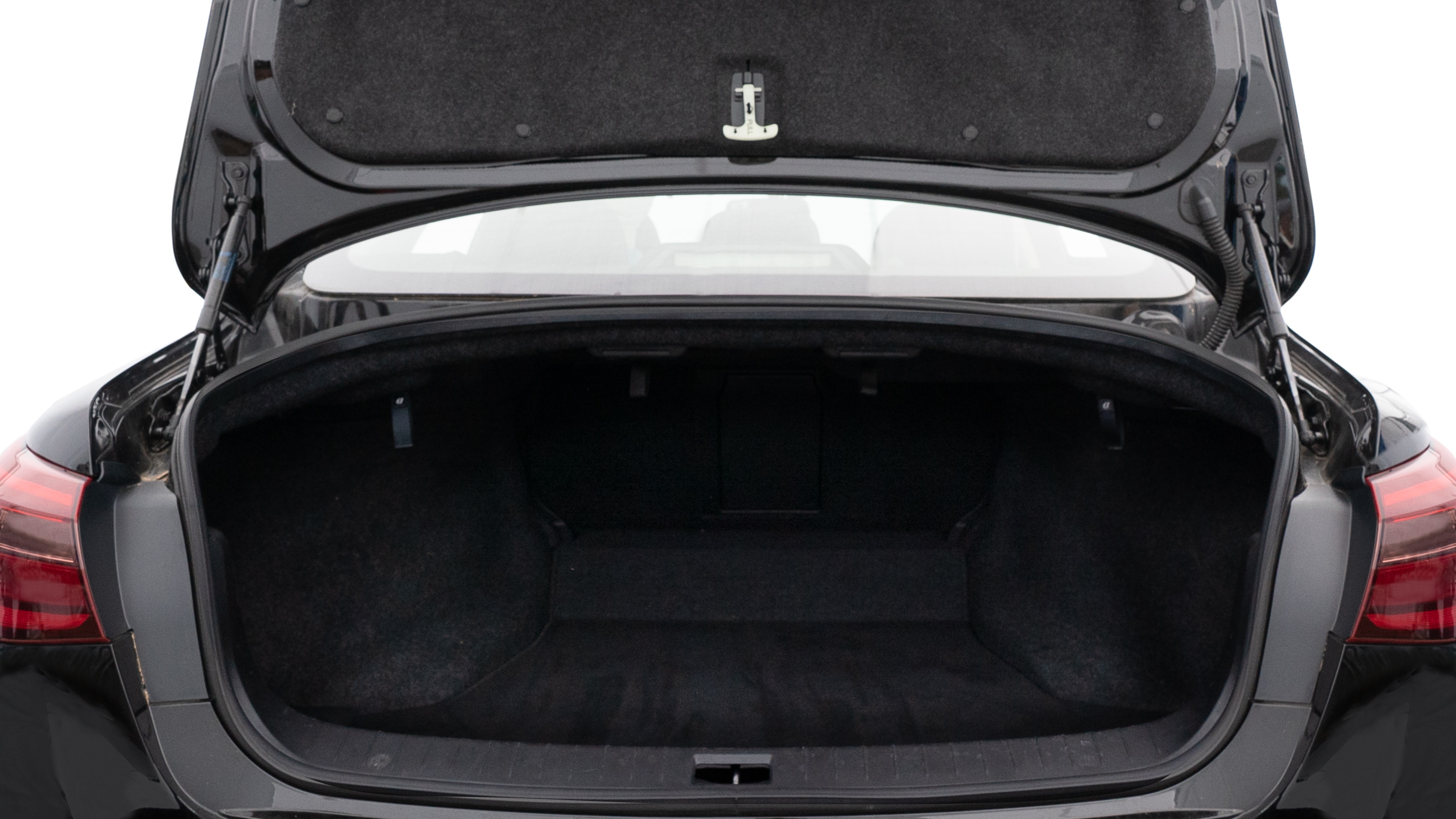 The trunk lid is open, showing full view of the trunk space. Two medium and one small suitcase are placed inside.