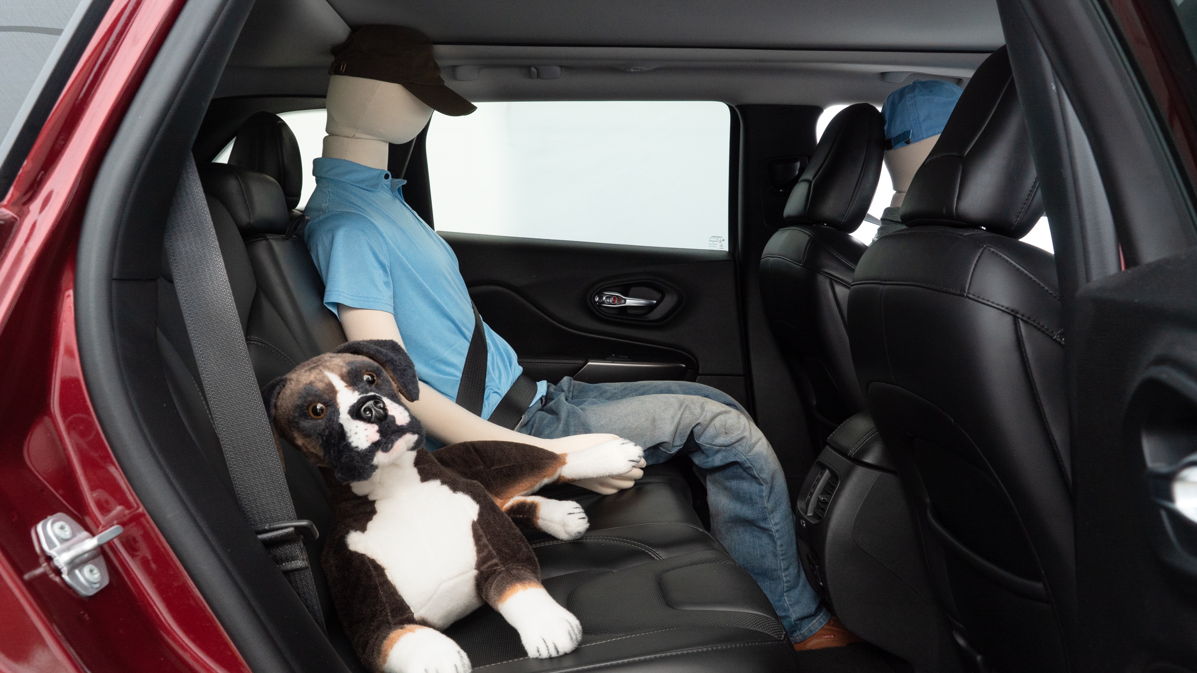 A series of second-row backseat photos is shown including one seating a baby seat and one seating a 6'1" mannequin.