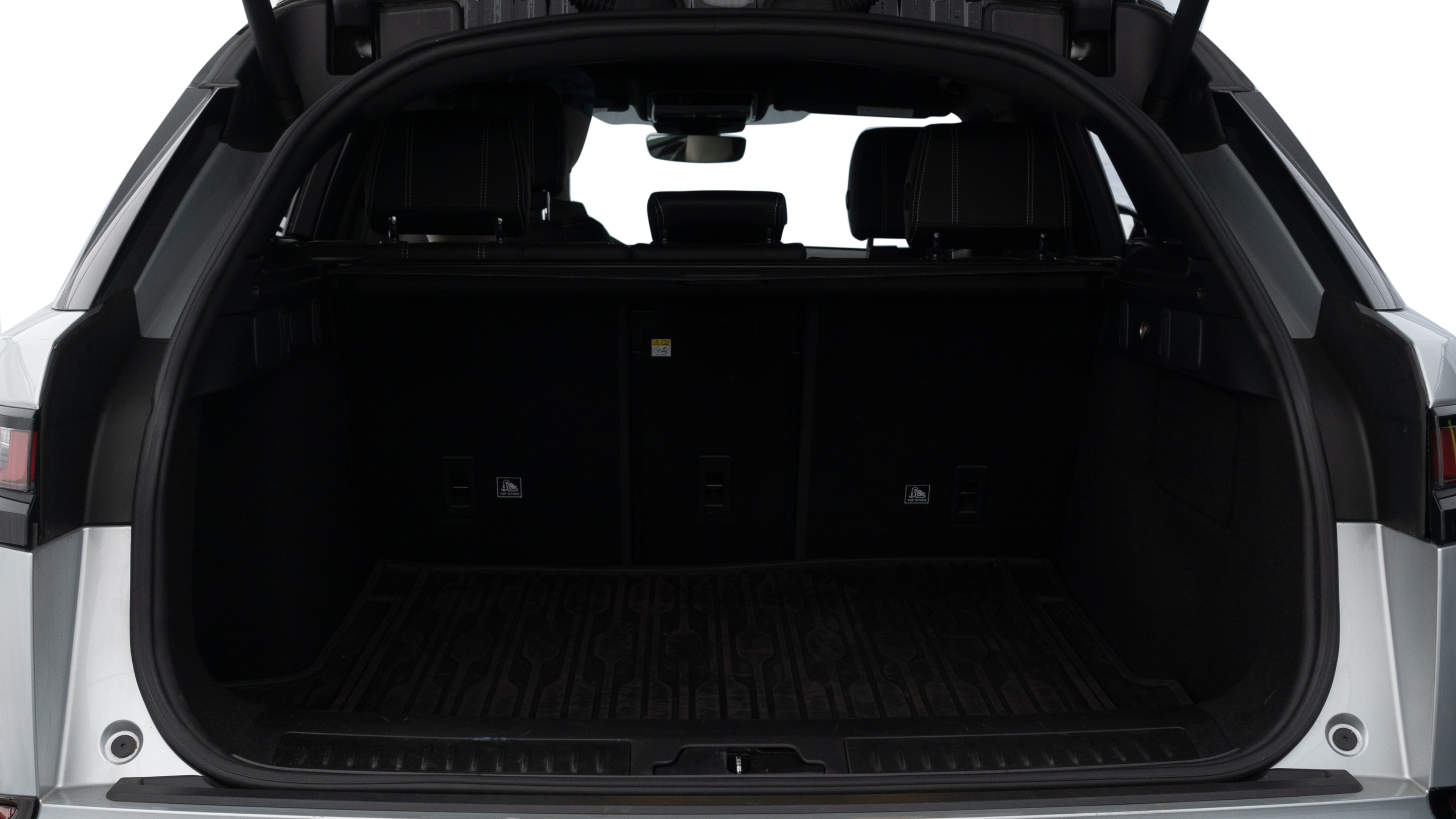 The trunk lid is open showing full view of the trunk. A baby stroller, three grocery carriers, two camping chairs in the carrying bag, and a set of golf clubs are placed inside.