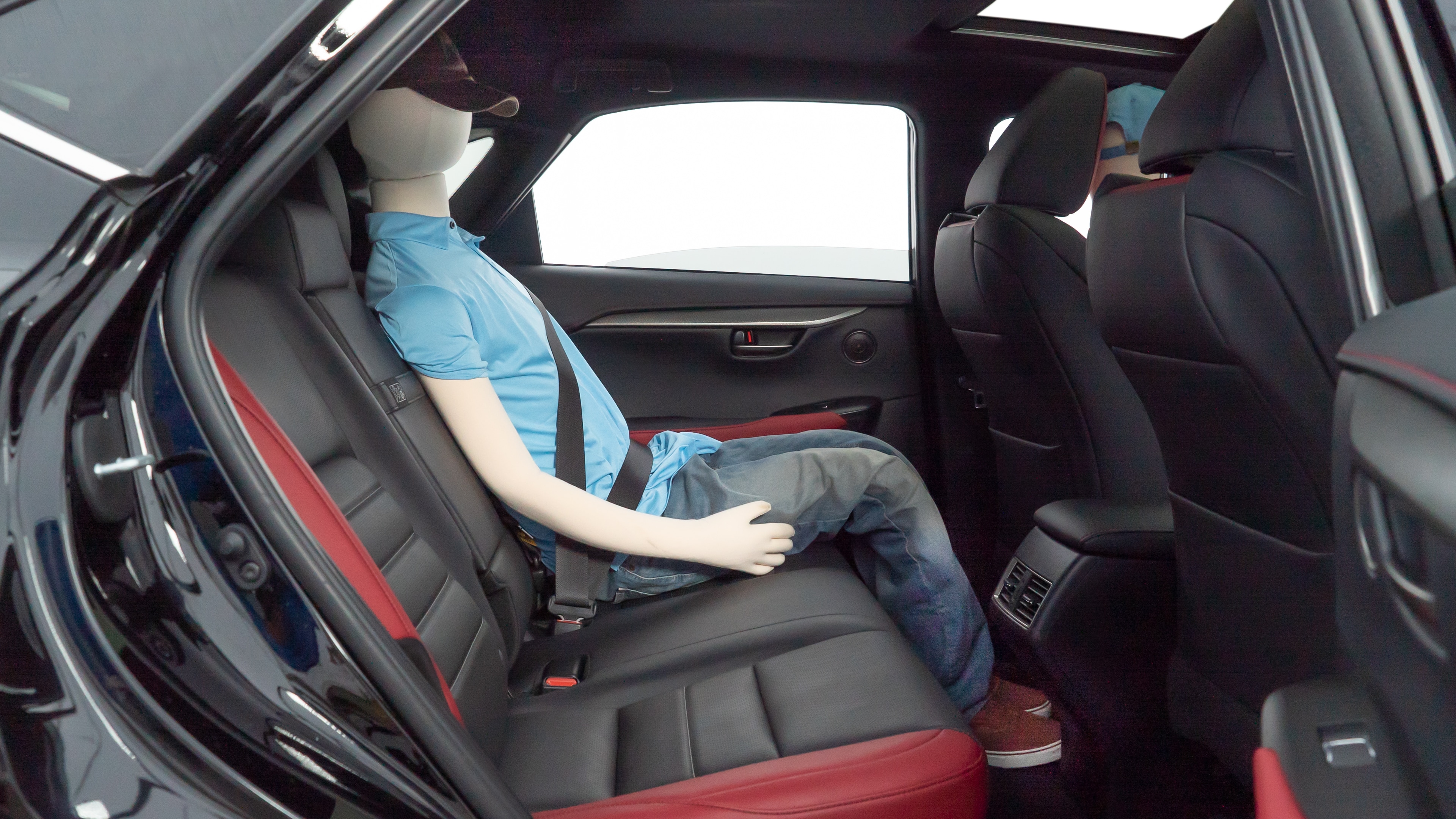 A series of second-row backseat photos is shown including one seating a baby seat and one seating a 6'1" mannequin