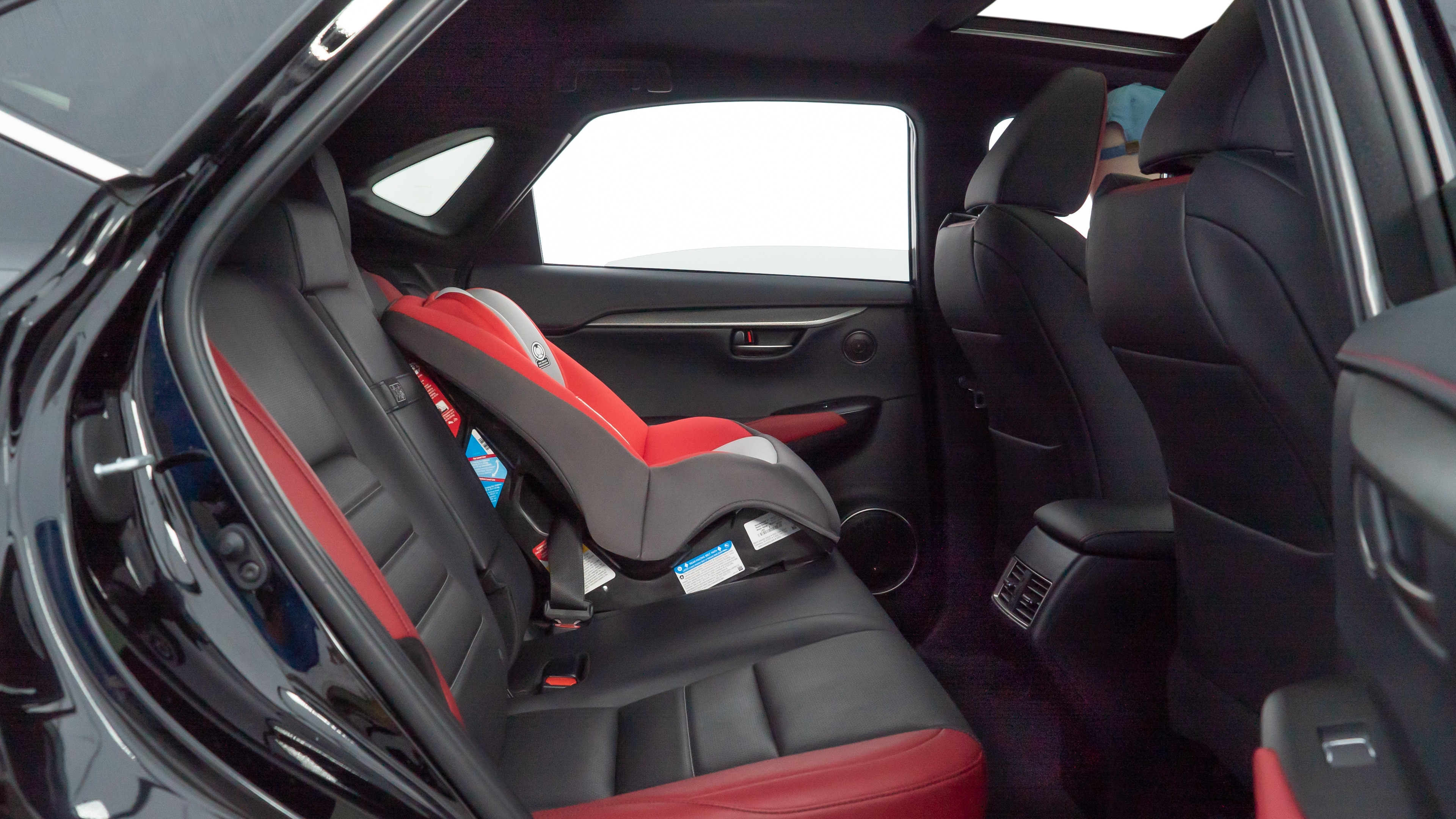 A series of second-row backseat photos is shown including one seating a baby seat and one seating a 6'1" mannequin