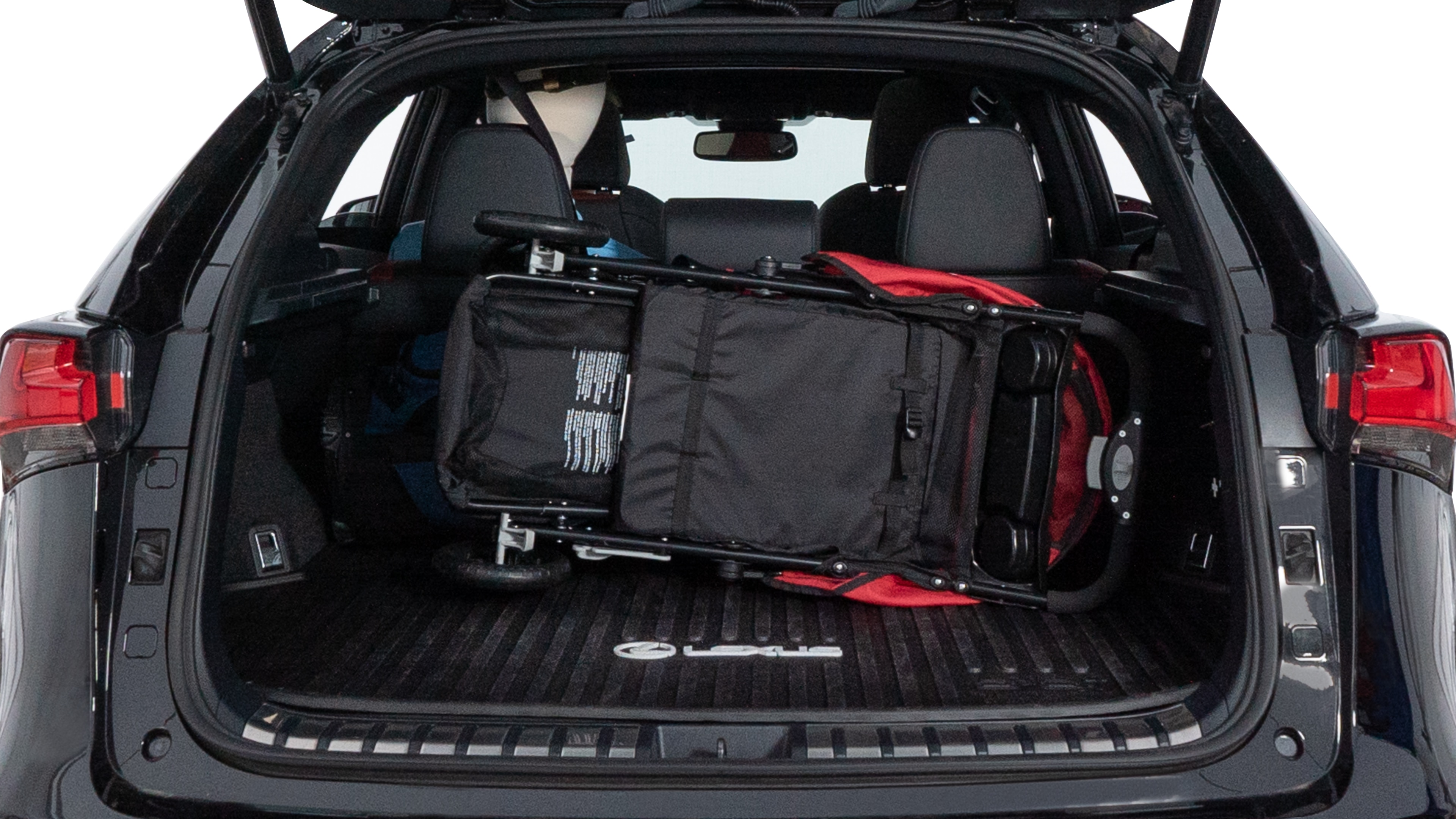 The trunk lid is open showing full view of the trunk. A baby stroller, three grocery carriers, two camping chairs in the carrying bag, and a set of golf clubs are placed inside.