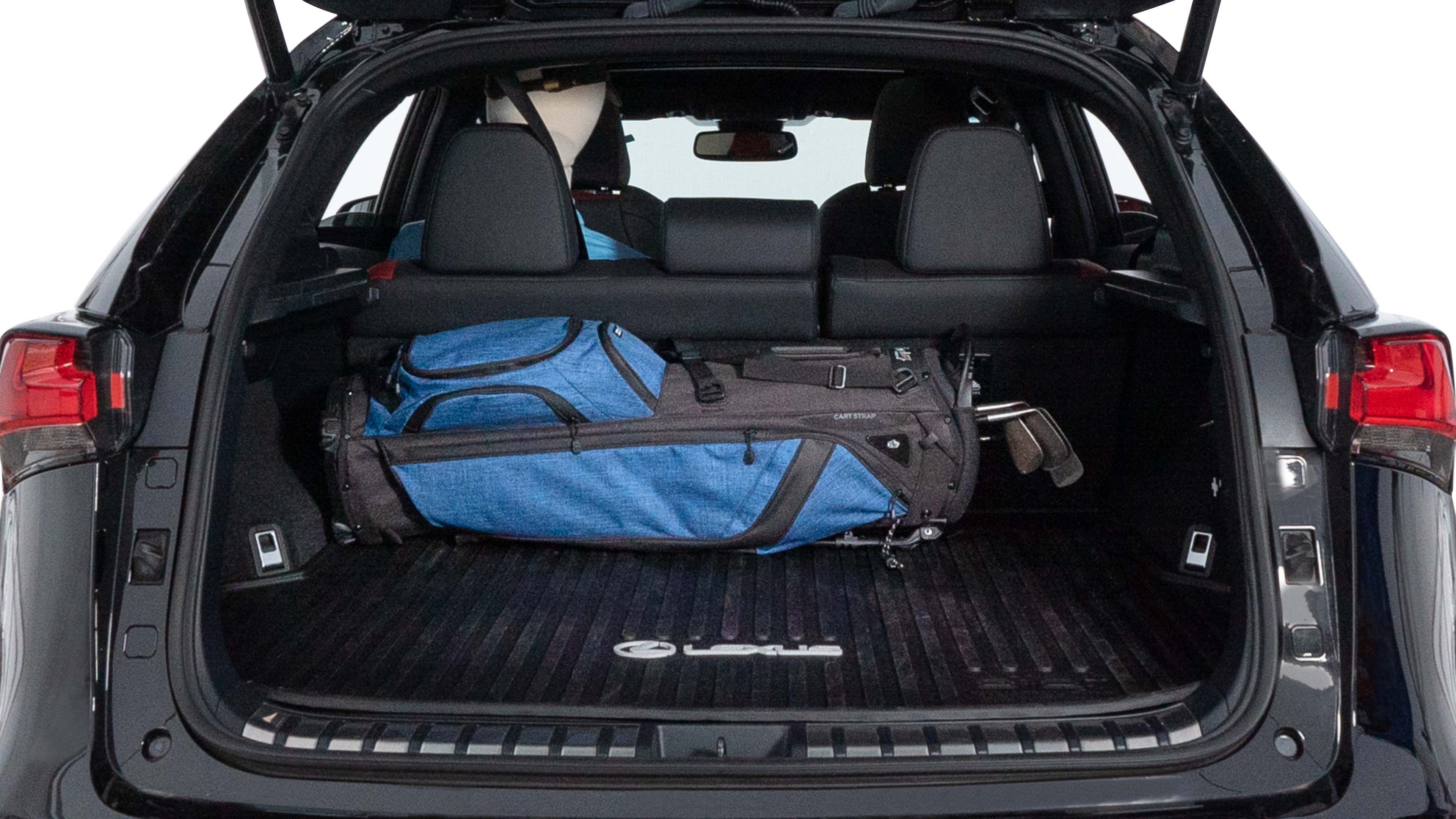 The trunk lid is open showing full view of the trunk. A baby stroller, three grocery carriers, two camping chairs in the carrying bag, and a set of golf clubs are placed inside.
