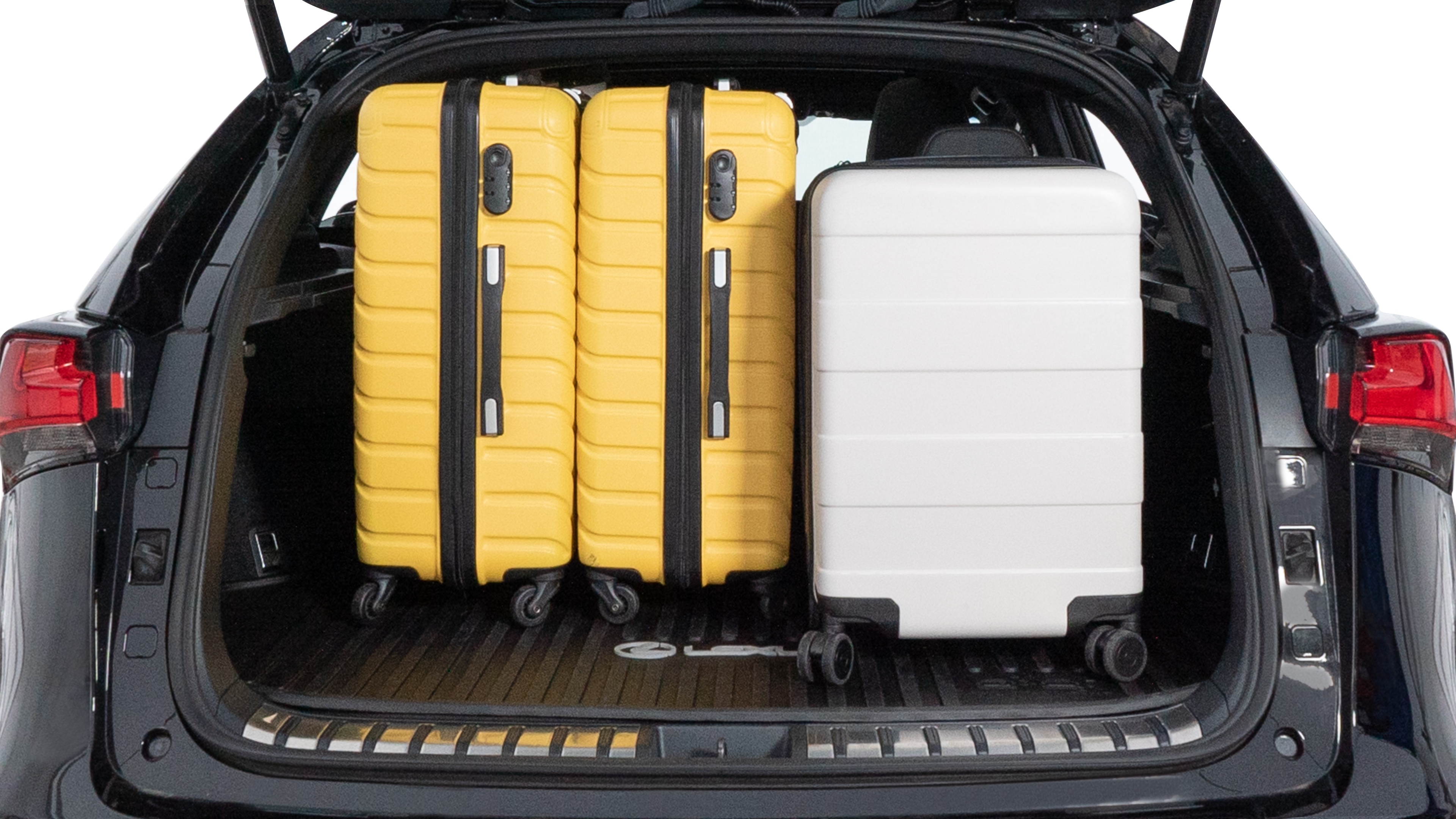 The trunk lid is open, showing full view of the trunk space. Two medium and two small suitcases are placed inside.