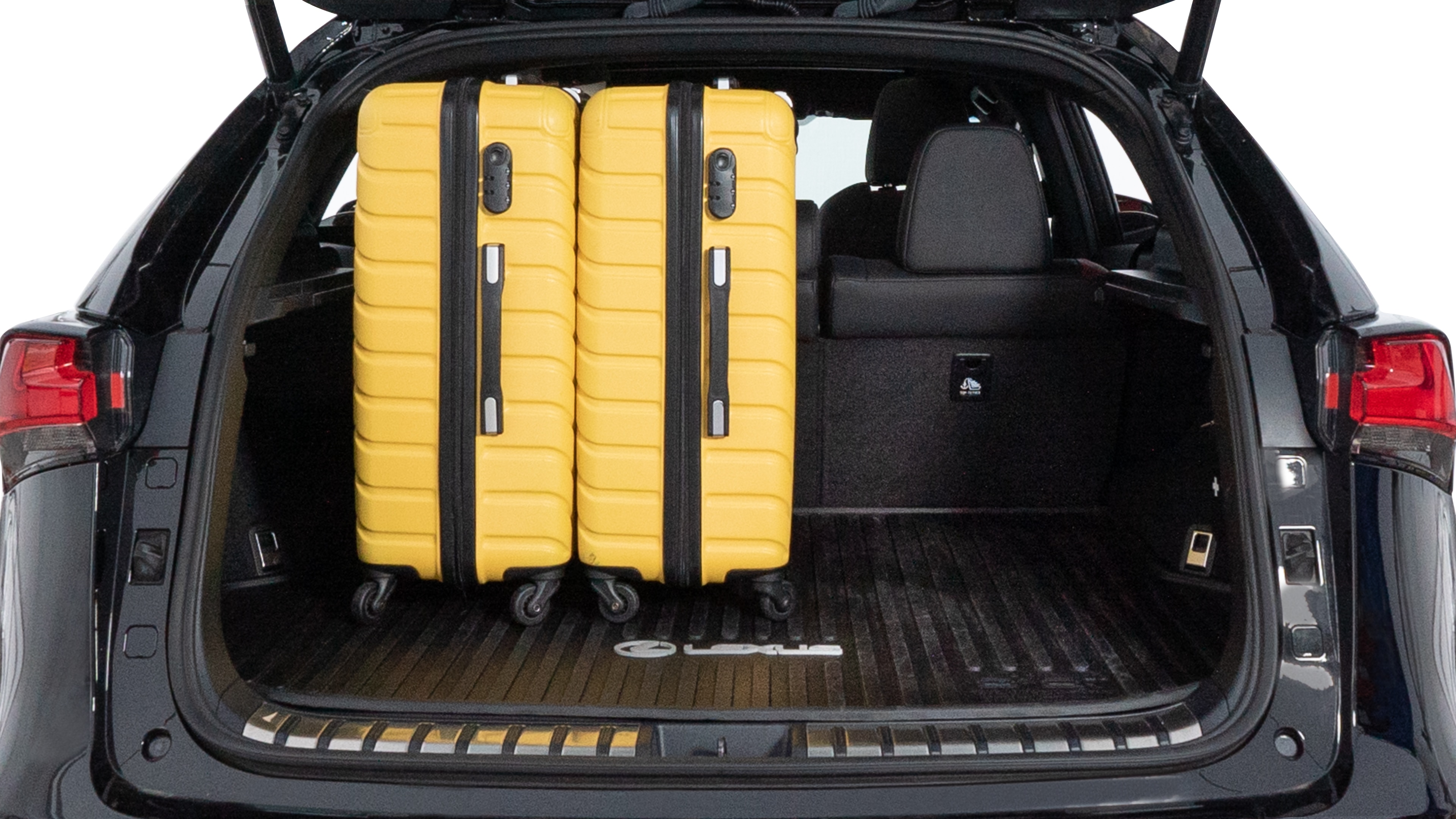 The trunk lid is open, showing full view of the trunk space. Two medium and two small suitcases are placed inside.