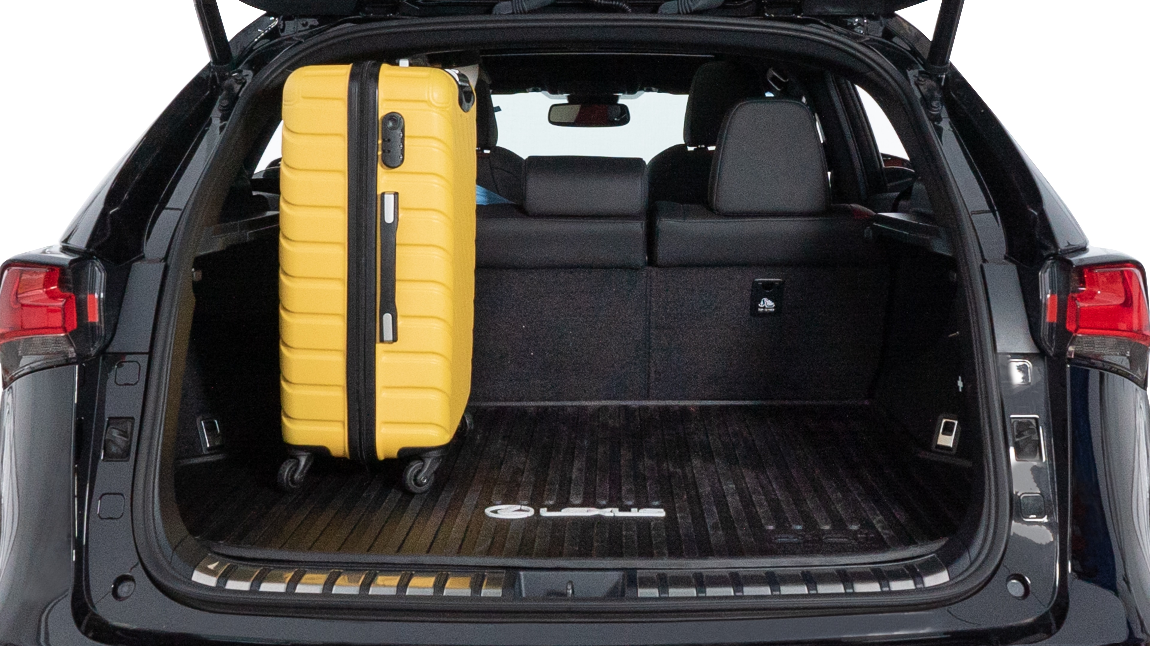 The trunk lid is open, showing full view of the trunk space. Two medium and two small suitcases are placed inside.