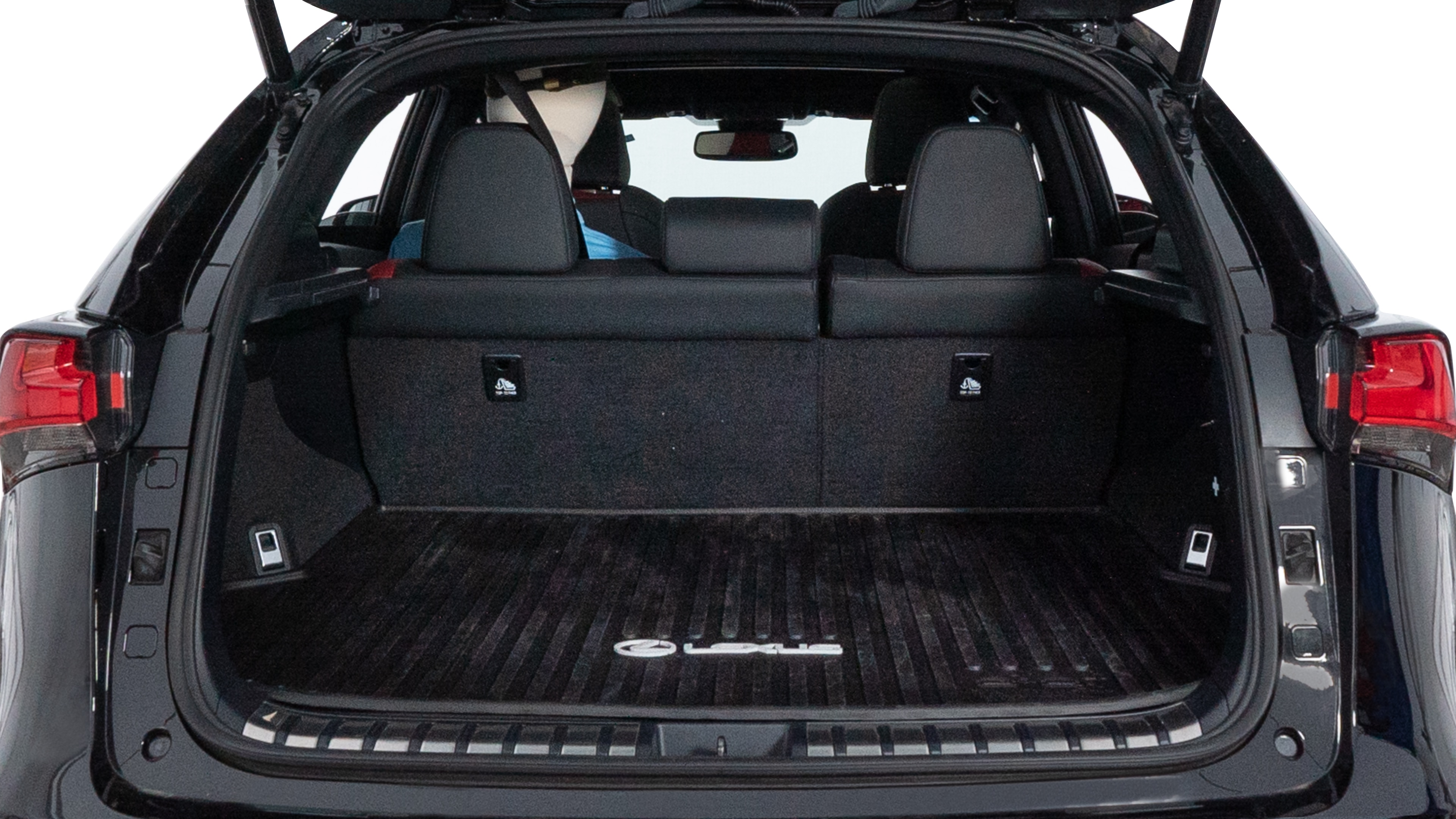 The trunk lid is open, showing full view of the trunk space. Two medium and two small suitcases are placed inside.