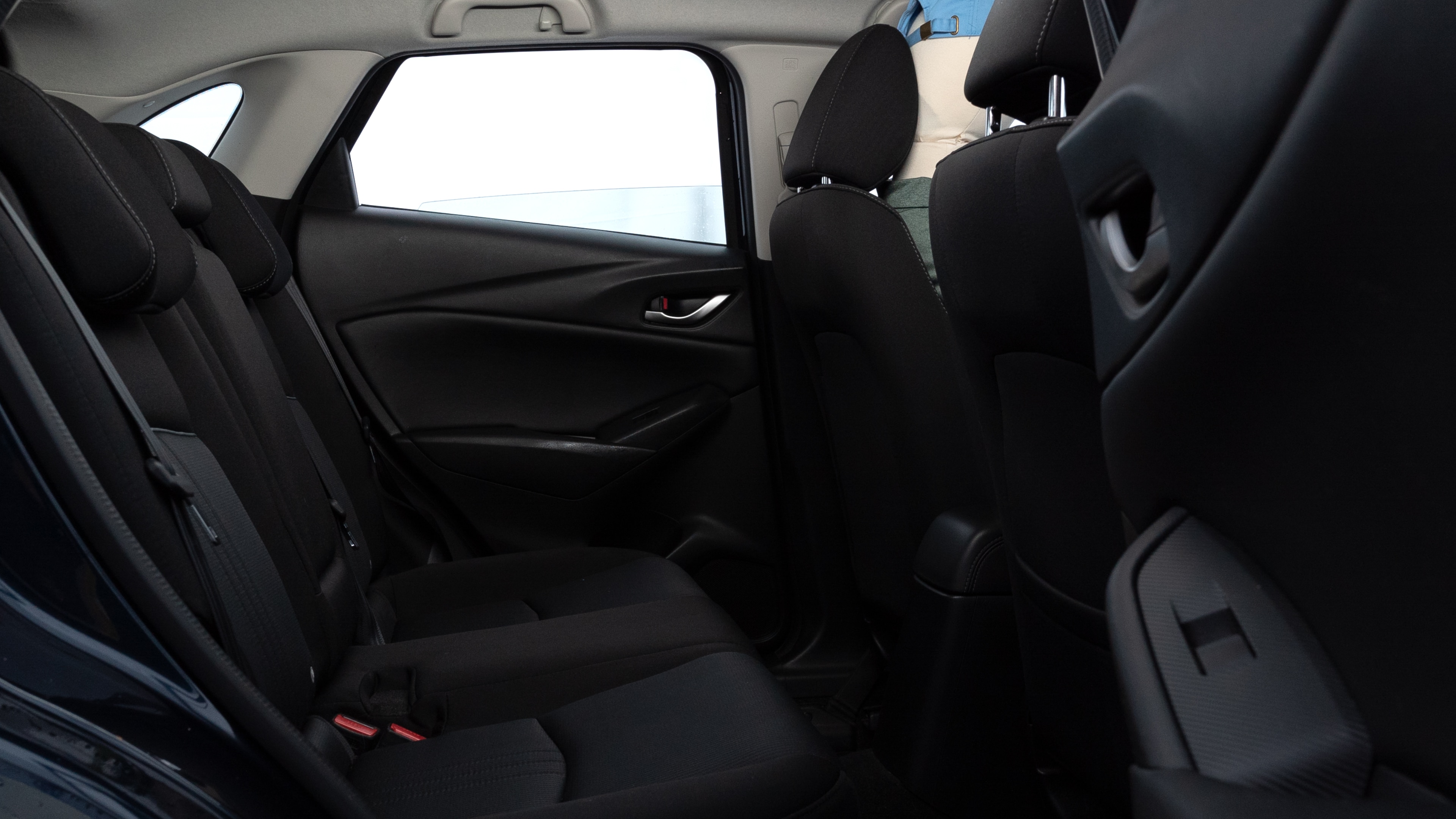A series of second-row backseat photos is shown including one seating a baby seat and one seating a 6'1" mannequin.