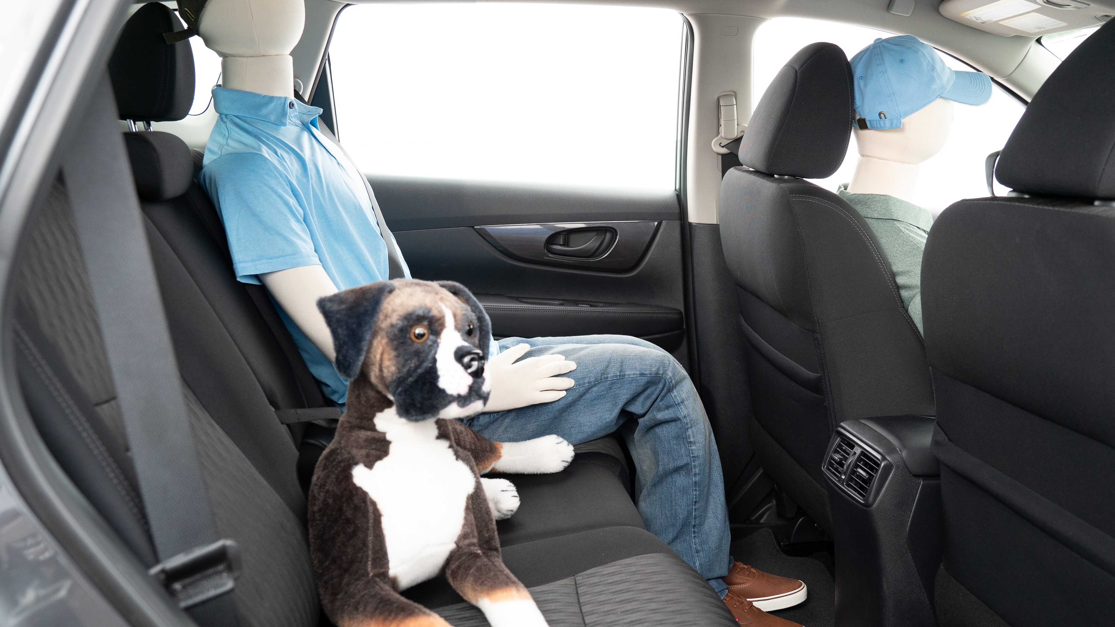 A series of second-row backseat photos is shown including one seating a baby seat and one seating a 6'1" mannequin.