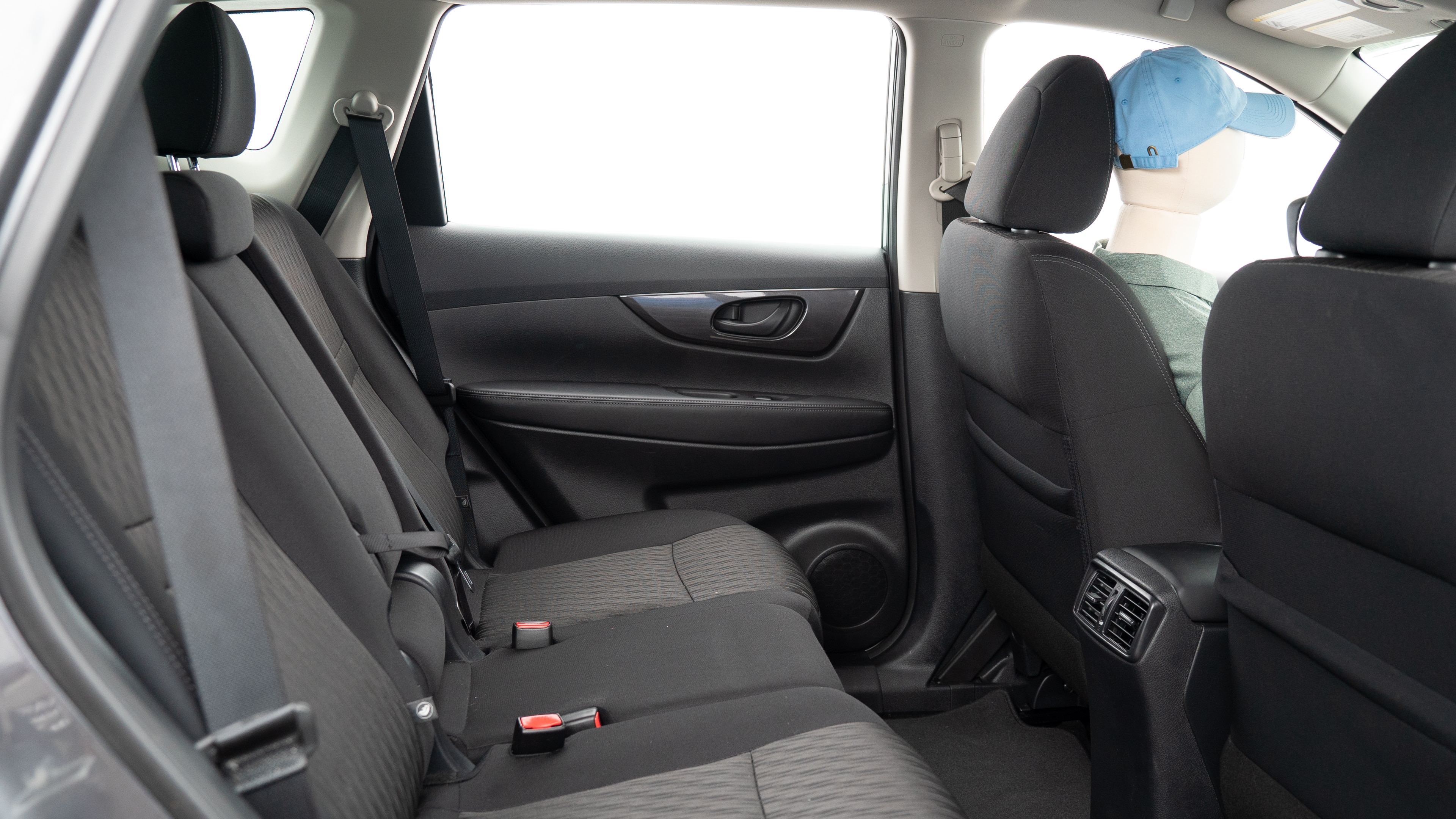 A series of second-row backseat photos is shown including one seating a baby seat and one seating a 6'1" mannequin.