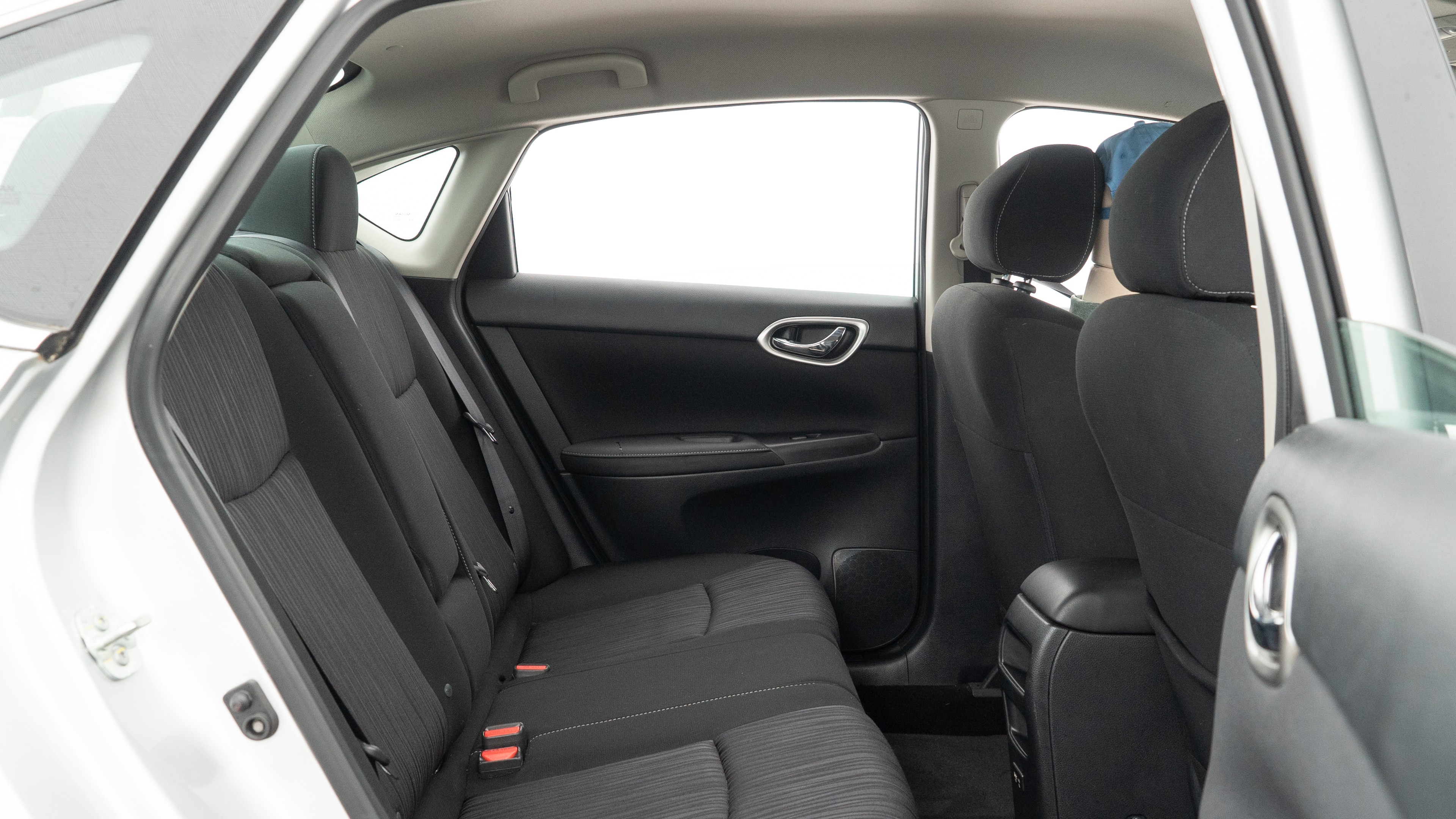 A series of second-row backseat photos is shown including one seating a baby seat and one seating a 6'1" mannequin.