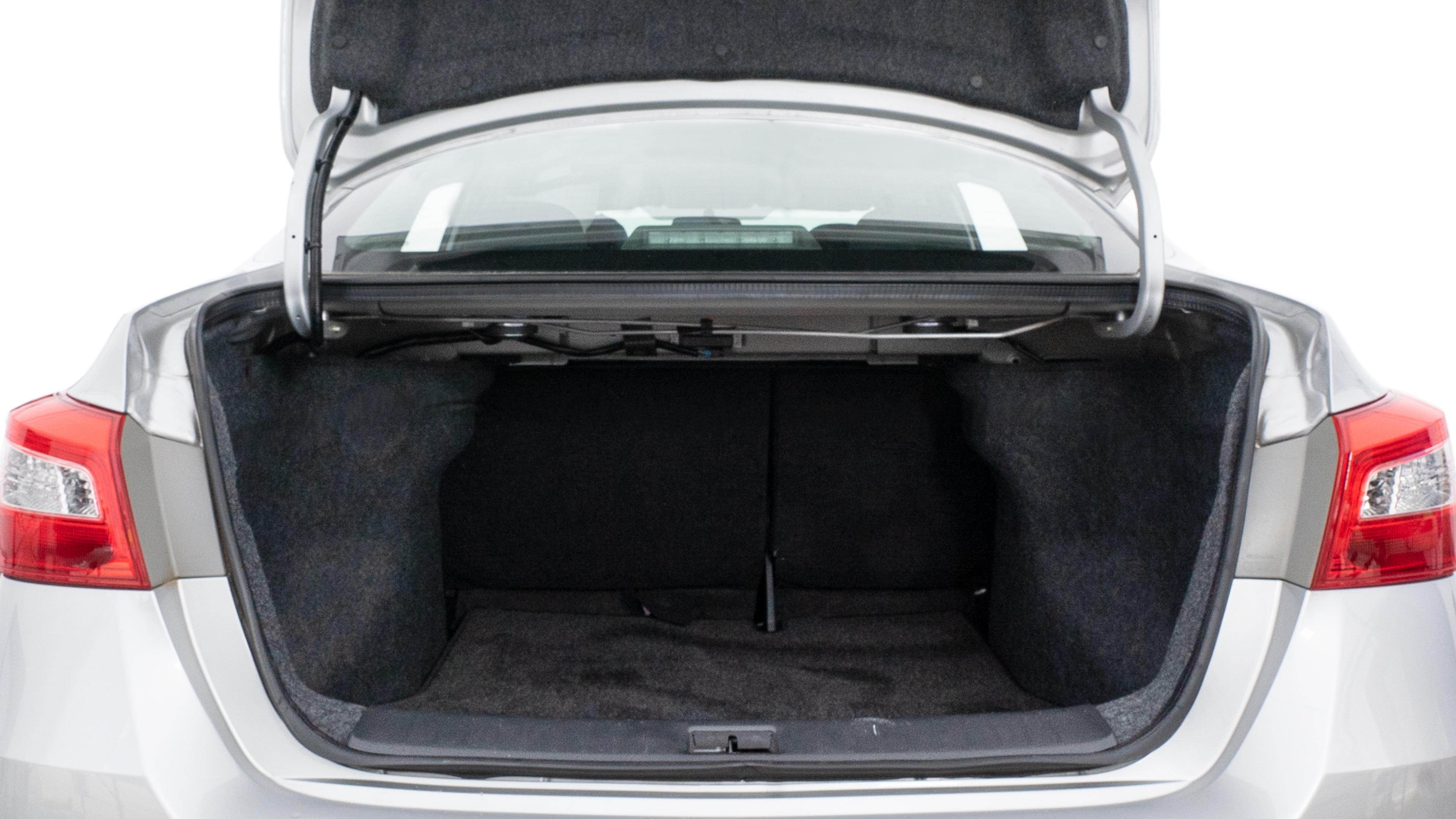 The trunk lid is open showing full view of the trunk. A baby stroller, three grocery carriers, two camping chairs in the carrying bag, and a set of golf clubs are placed inside.