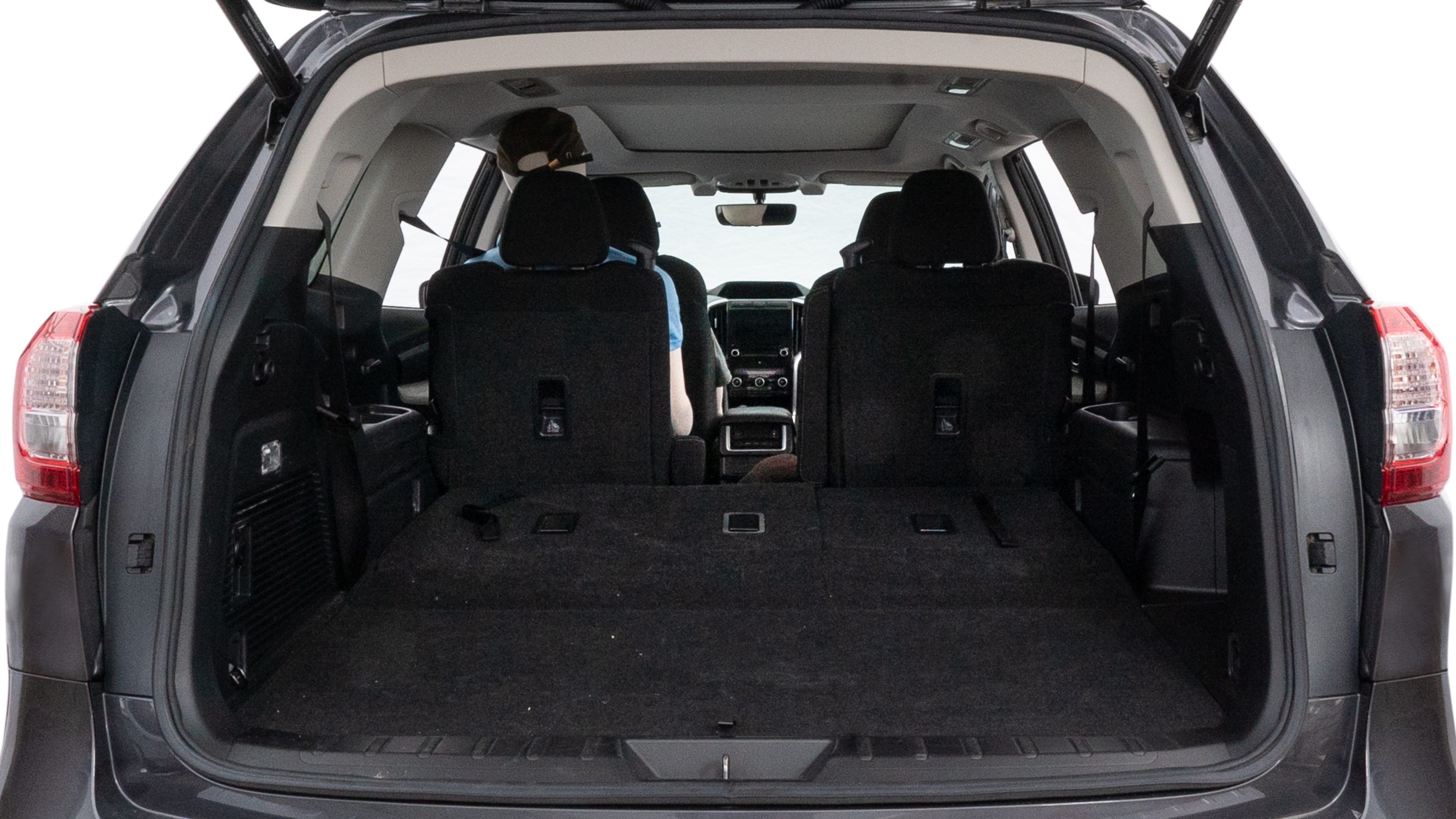 The trunk lid is open showing full view of the trunk. A baby stroller, three grocery carriers, two camping chairs in the carrying bag, and a set of golf clubs are placed inside.