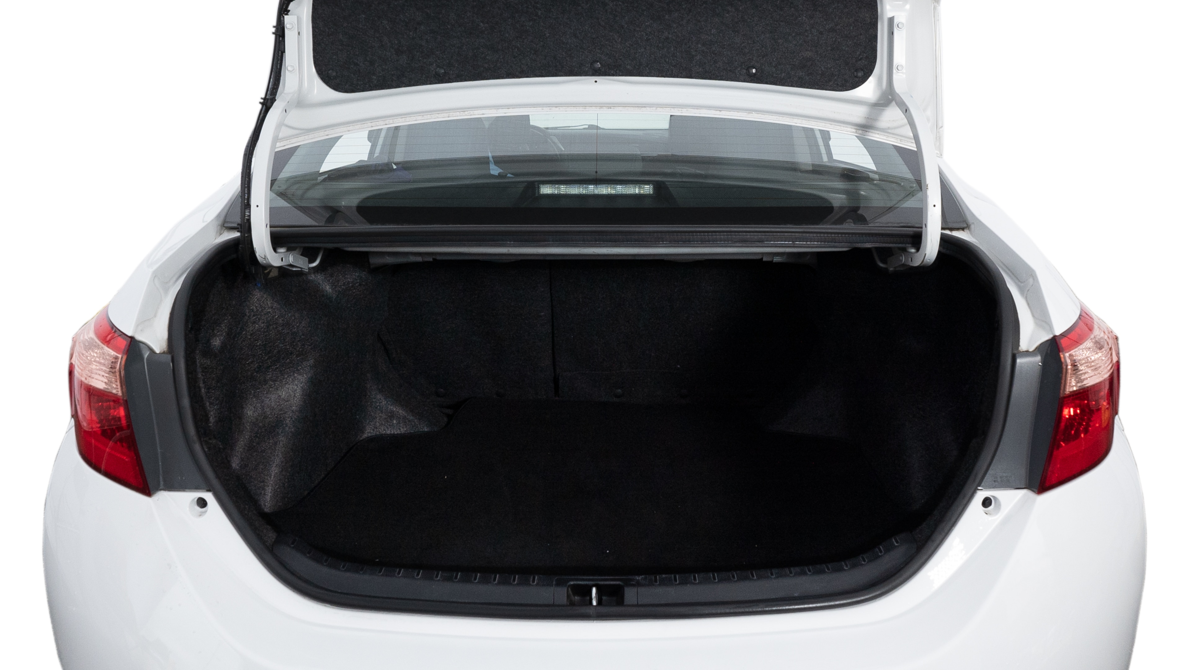 The trunk lid is open showing full view of the trunk. A baby stroller, three grocery carriers, two camping chairs in the carrying bag, and a set of golf clubs are placed inside.