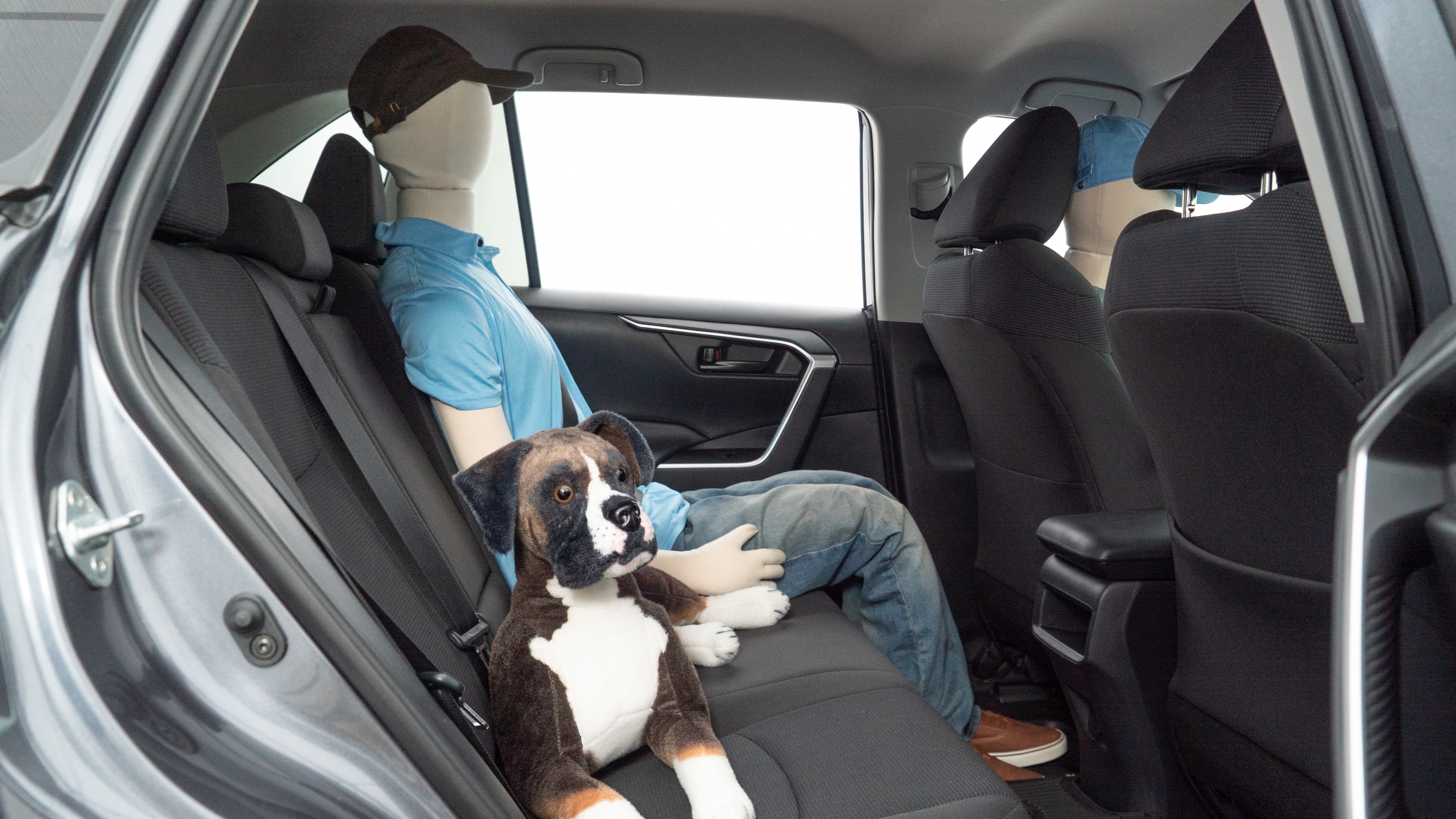 A series of second-row backseat photos is shown including one seating a baby seat and one seating a 6'1" mannequin.