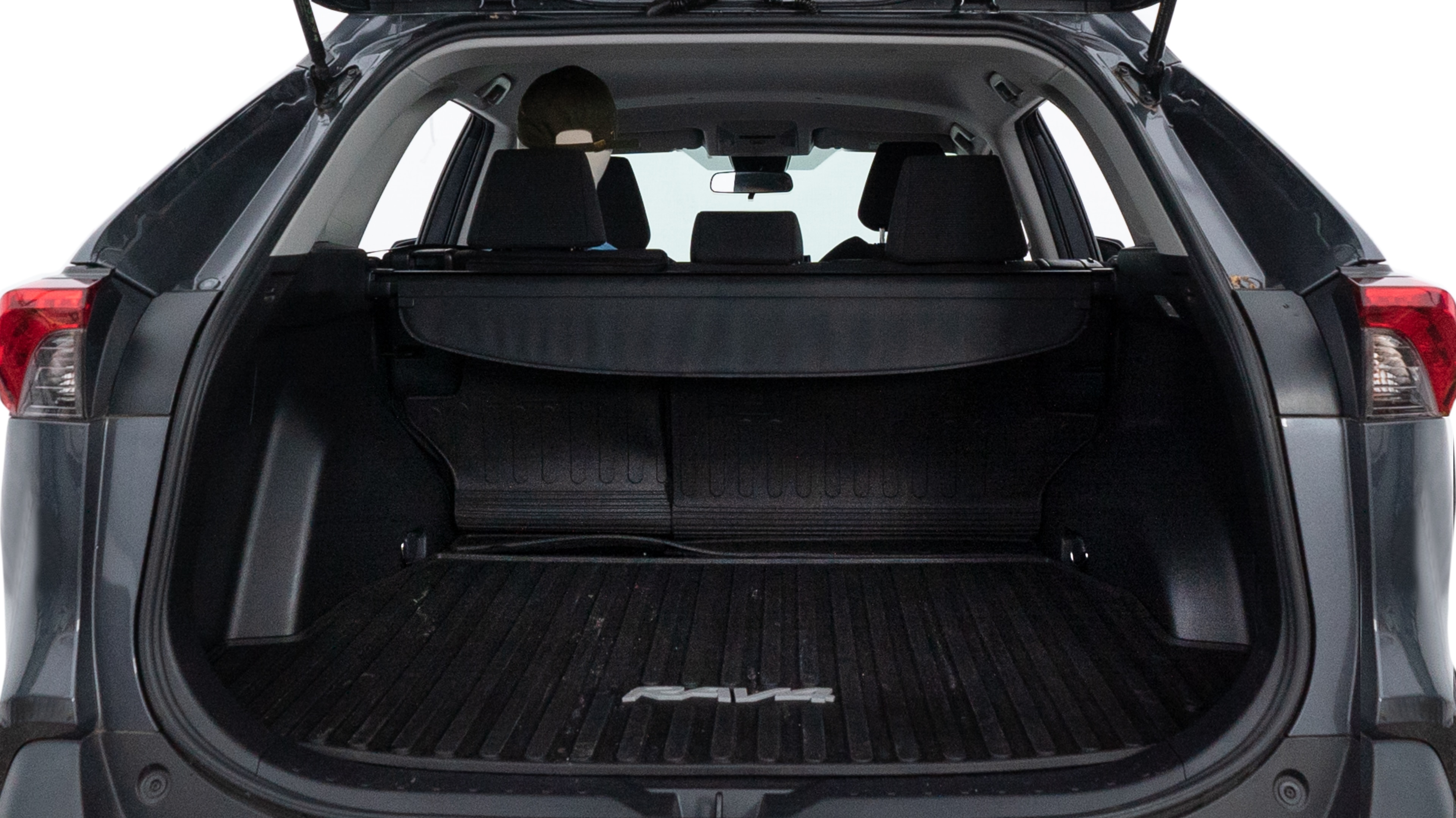 The trunk lid is open showing full view of the trunk. A baby stroller, three grocery carriers, two camping chairs in the carrying bag, and a set of golf clubs are placed inside.