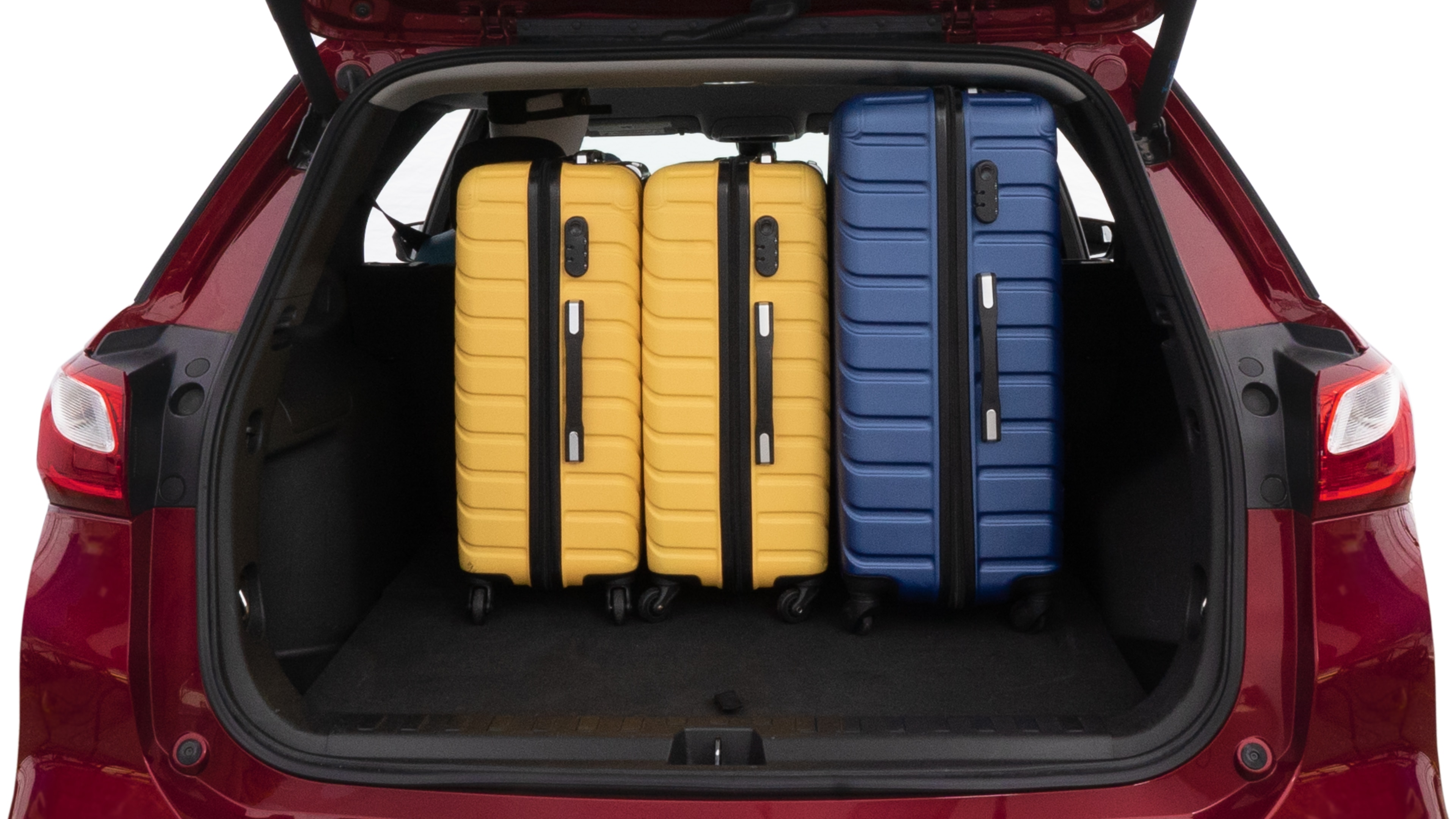 The trunk lid is open, showing full view of the trunk space. One large suitcase, two medium suitcases and one small suitcase are placed inside.