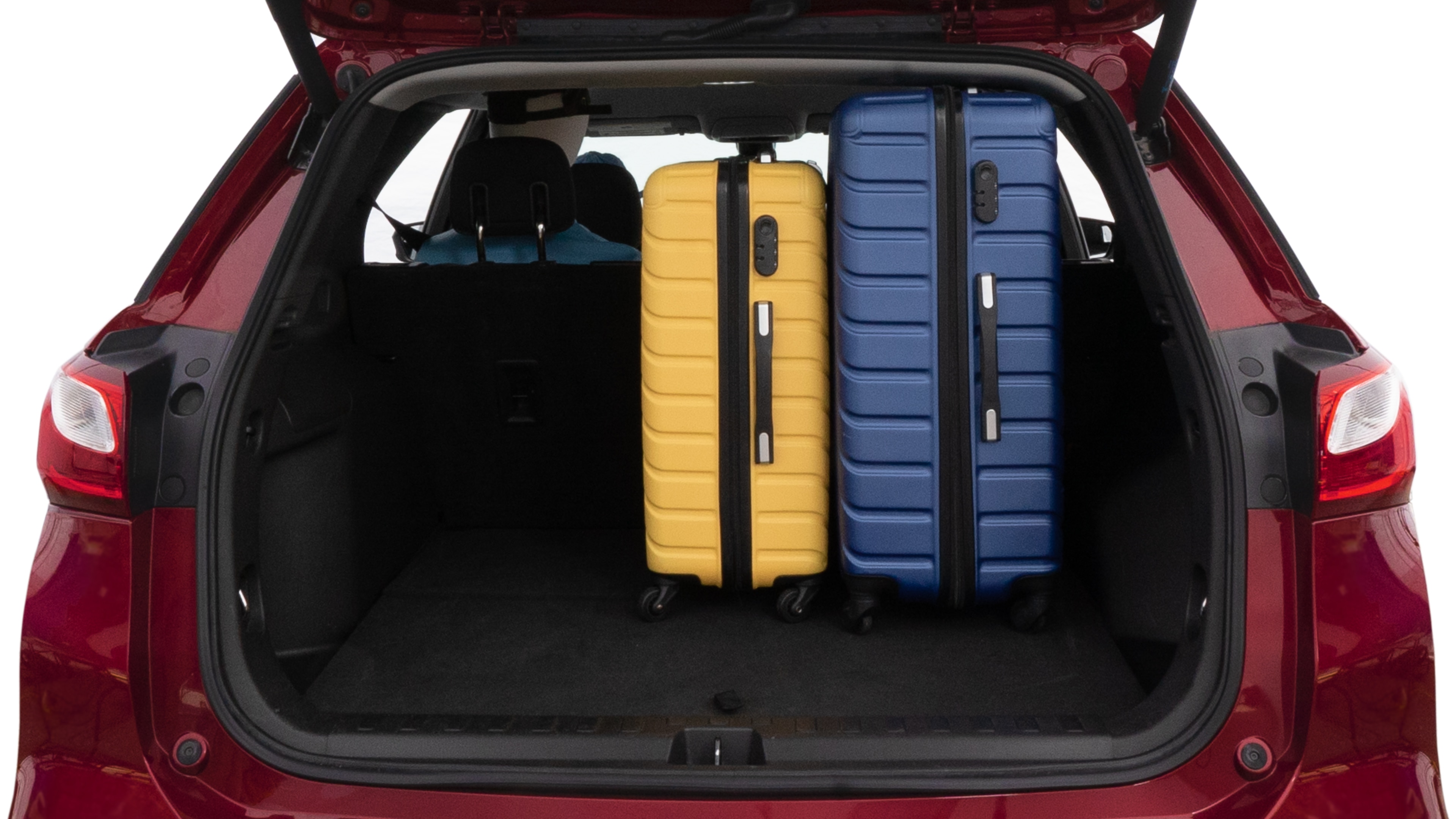 The trunk lid is open, showing full view of the trunk space. One large suitcase, two medium suitcases and one small suitcase are placed inside.