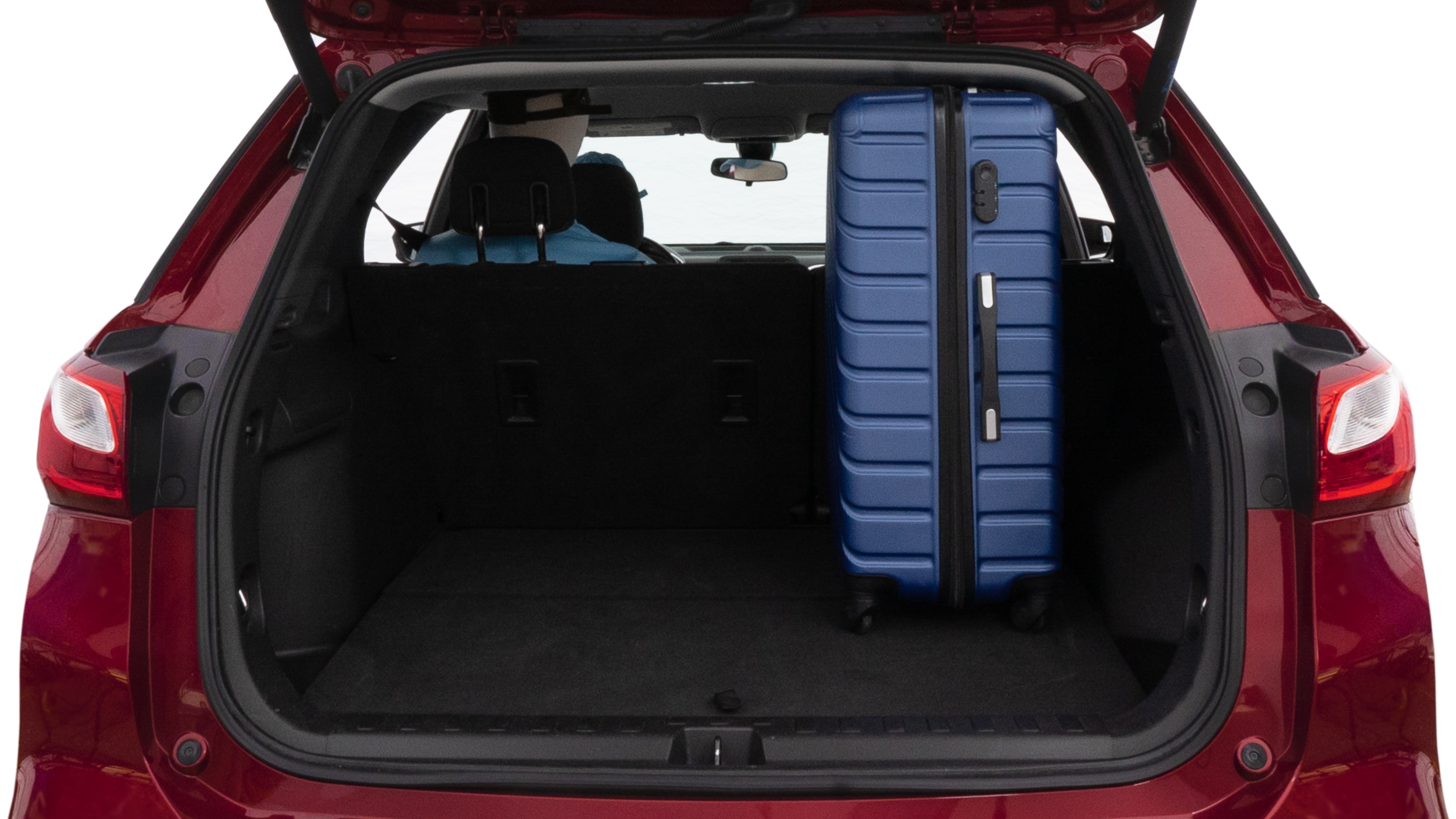 The trunk lid is open, showing full view of the trunk space. One large suitcase, two medium suitcases and one small suitcase are placed inside.
