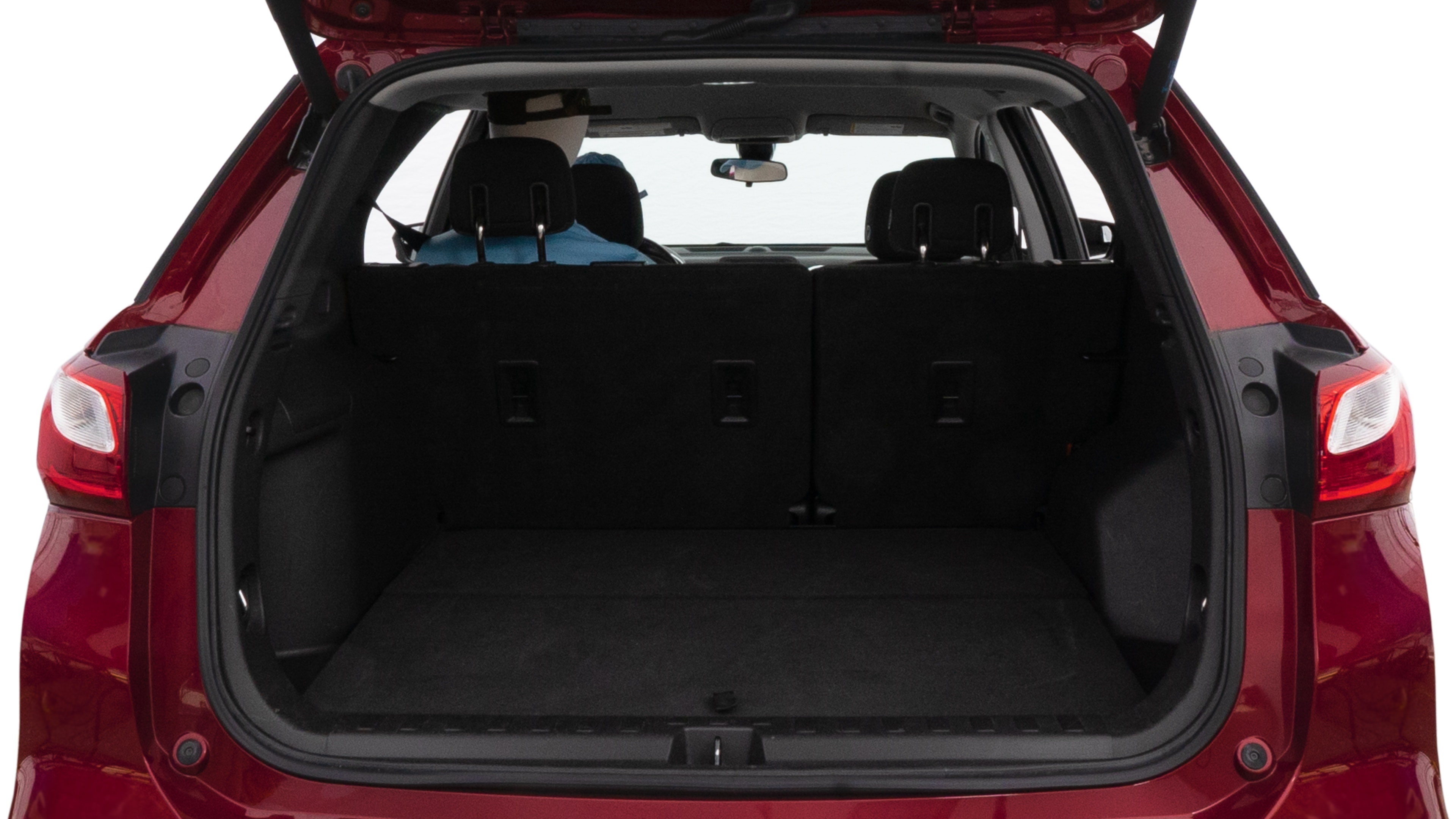The trunk lid is open, showing full view of the trunk space. One large suitcase, two medium suitcases and one small suitcase are placed inside.