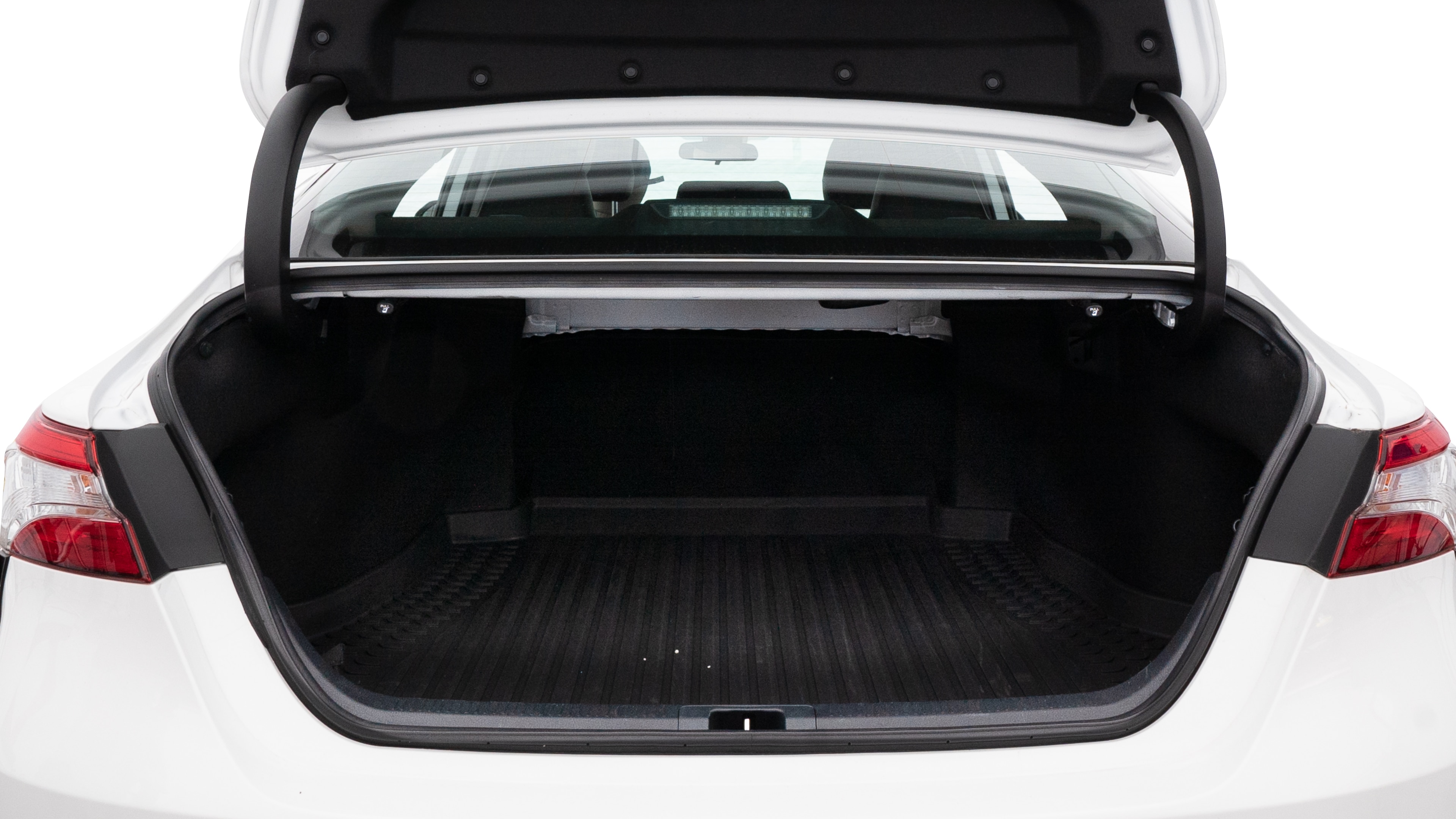 The trunk lid is open showing full view of the trunk. A baby stroller, three grocery carriers, two camping chairs in the carrying bag, and a set of golf clubs are placed inside.
