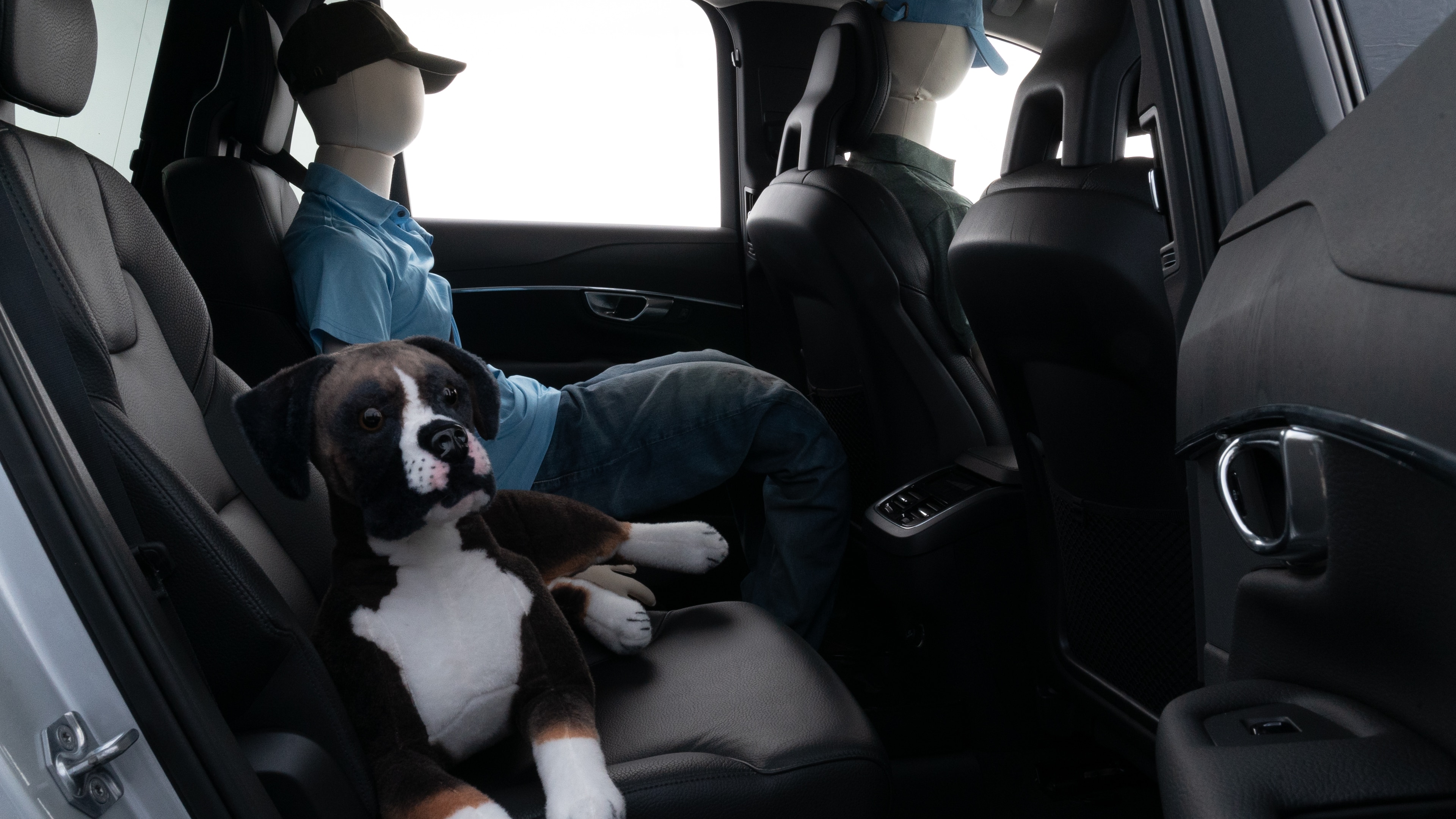 A series of second-row backseat photos is shown including one seating a baby seat and one seating a 6'1" mannequin.