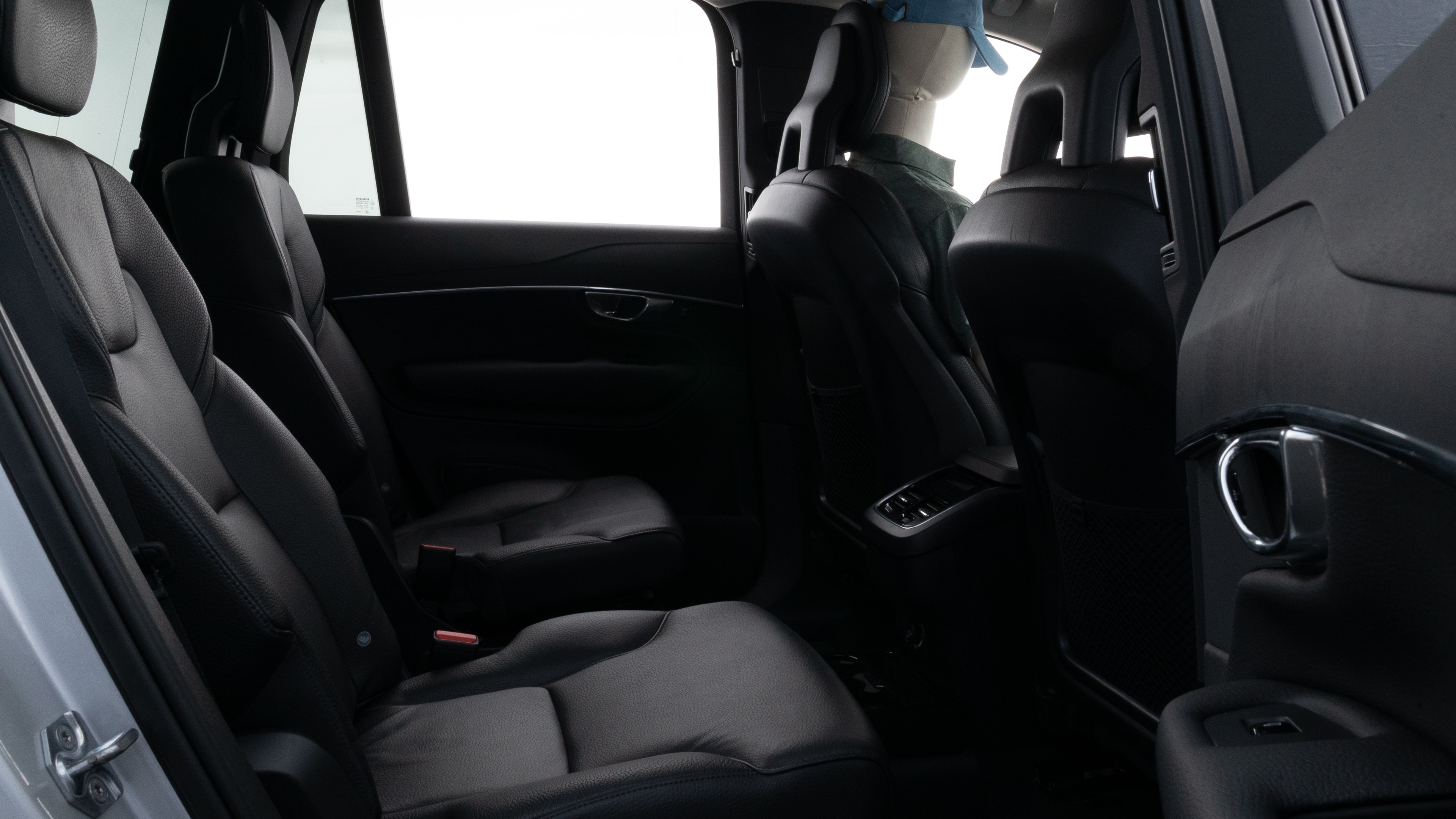 A series of second-row backseat photos is shown including one seating a baby seat and one seating a 6'1" mannequin.