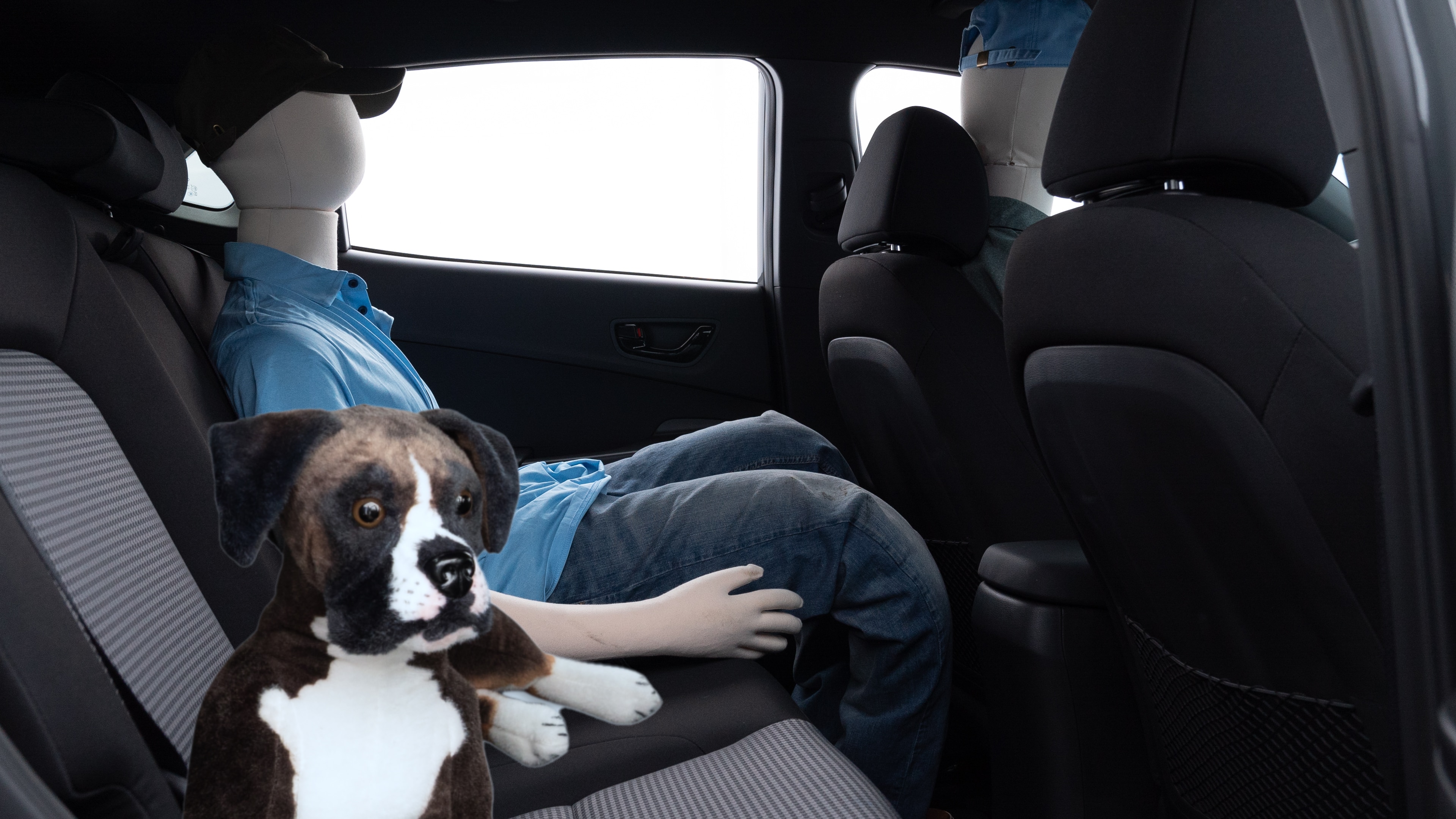 A series of second-row backseat photos is shown including one seating a baby seat and one seating a 6'1" mannequin.