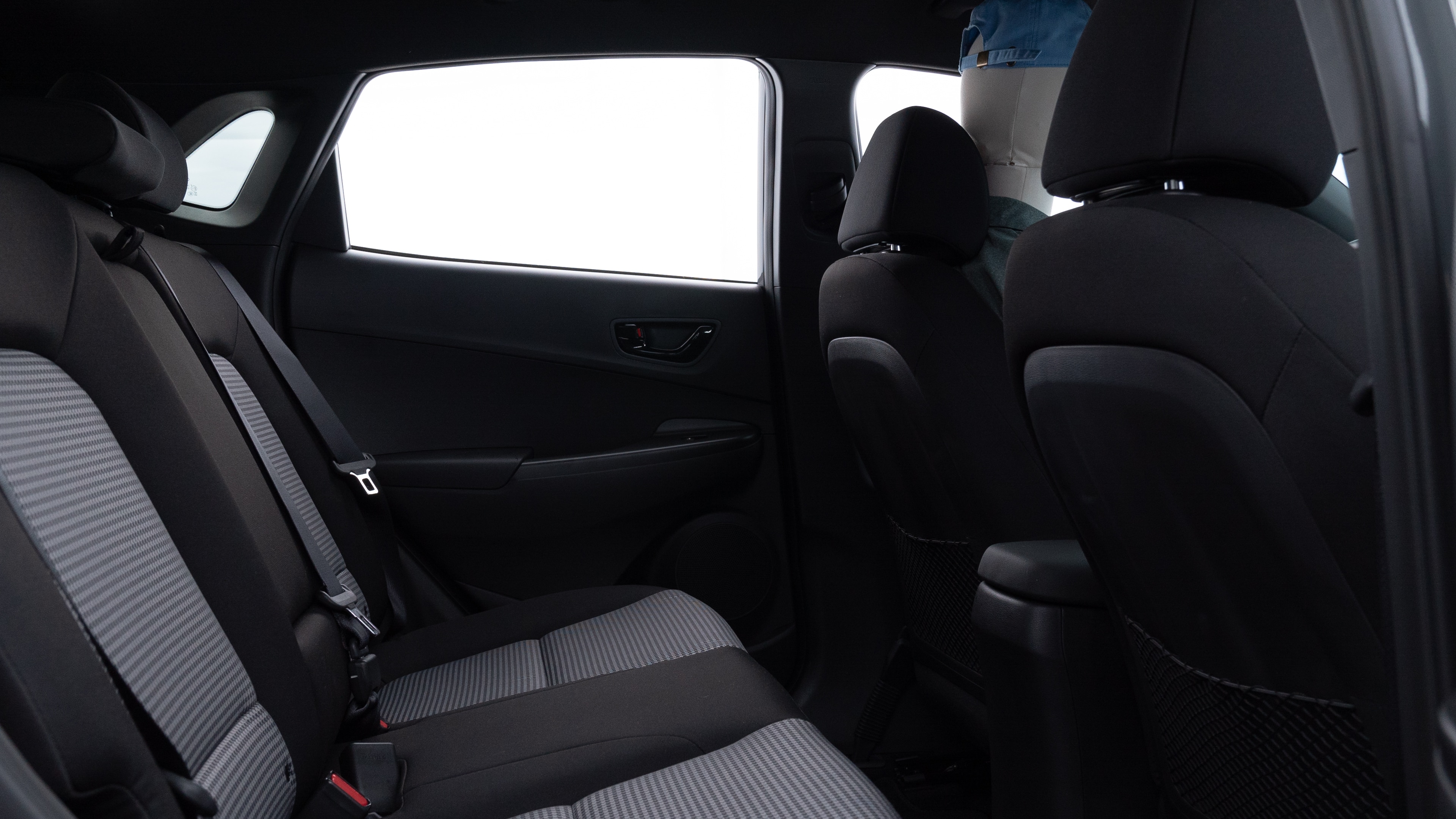 A series of second-row backseat photos is shown including one seating a baby seat and one seating a 6'1" mannequin.