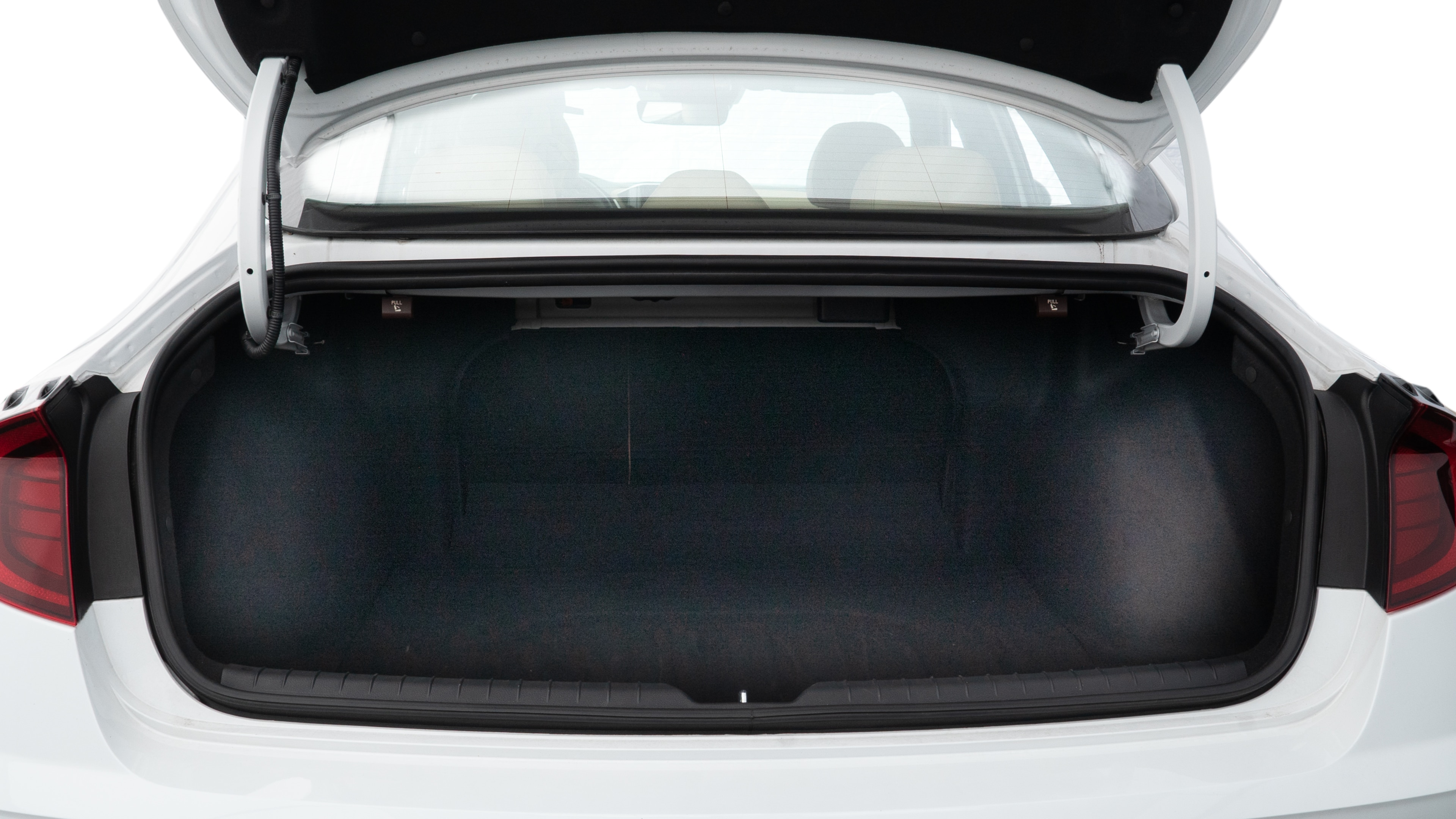 The trunk lid is open showing full view of the trunk. A baby stroller, three grocery carriers, two camping chairs in the carrying bag, and a set of golf clubs are placed inside.