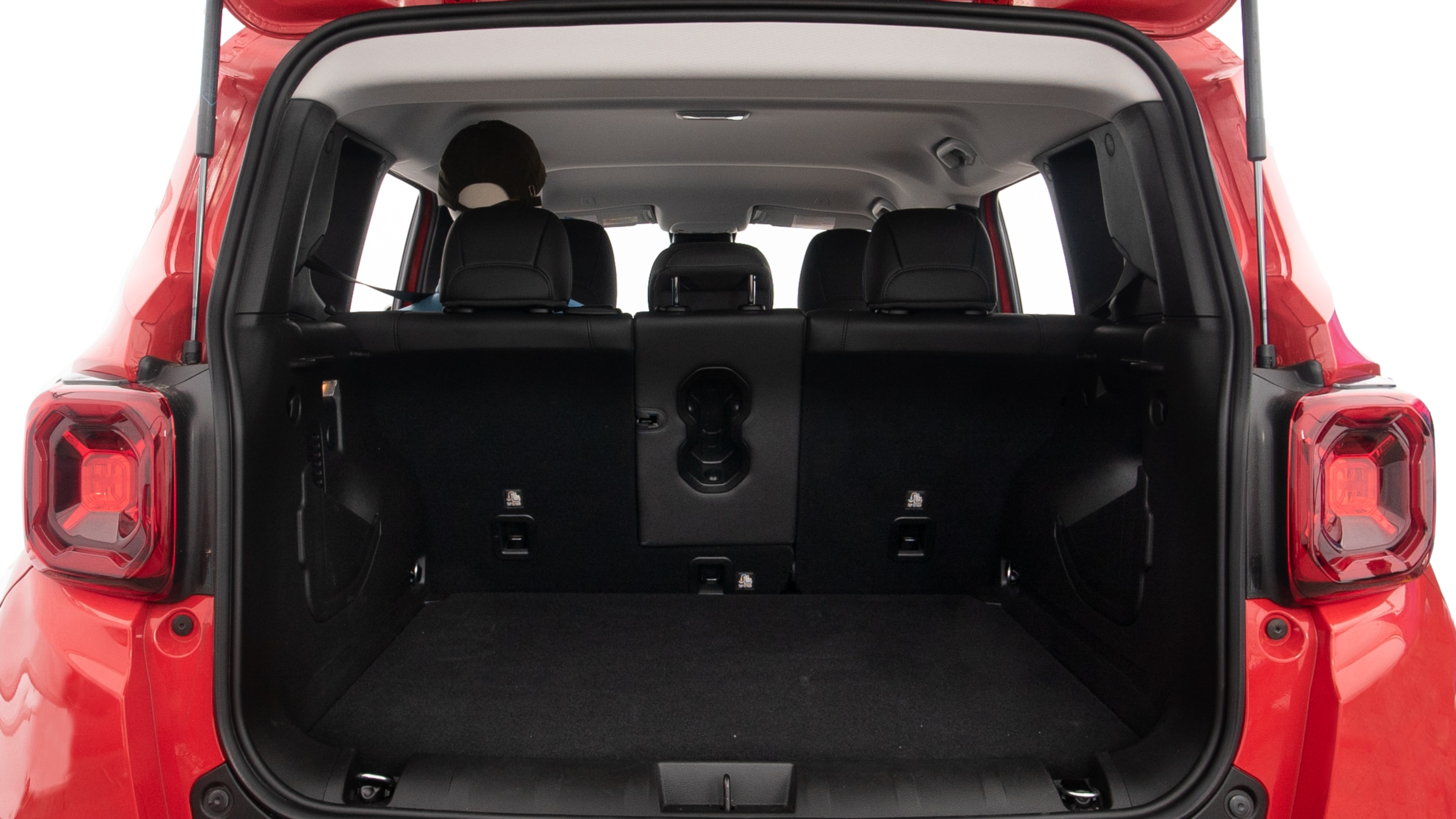 The trunk lid is open showing full view of the trunk. A baby stroller, three grocery carriers, two camping chairs in the carrying bag, and a set of golf clubs are placed inside.