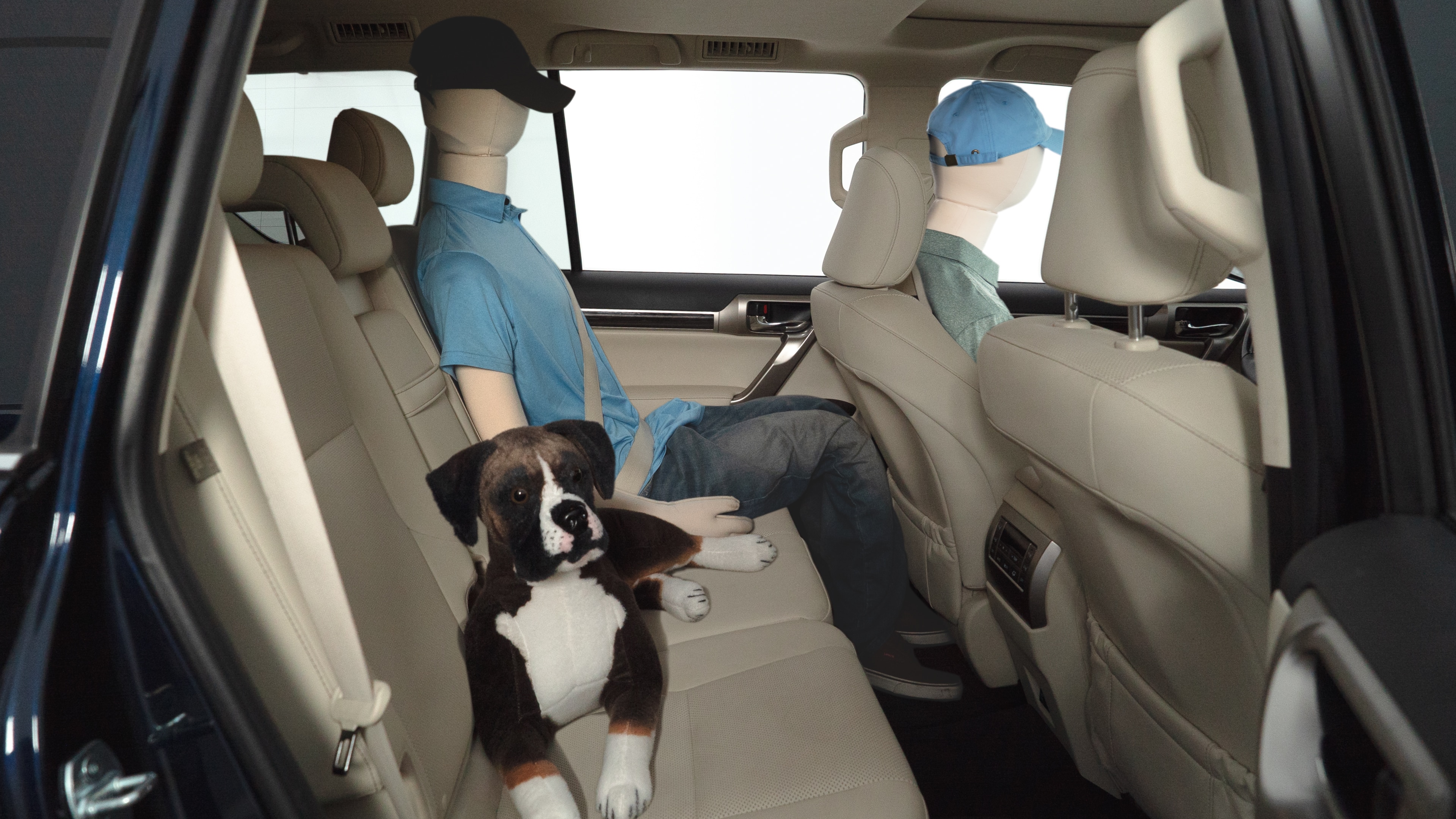 A series of second-row backseat photos is shown including one seating a baby seat and one seating a 6'1" mannequin.