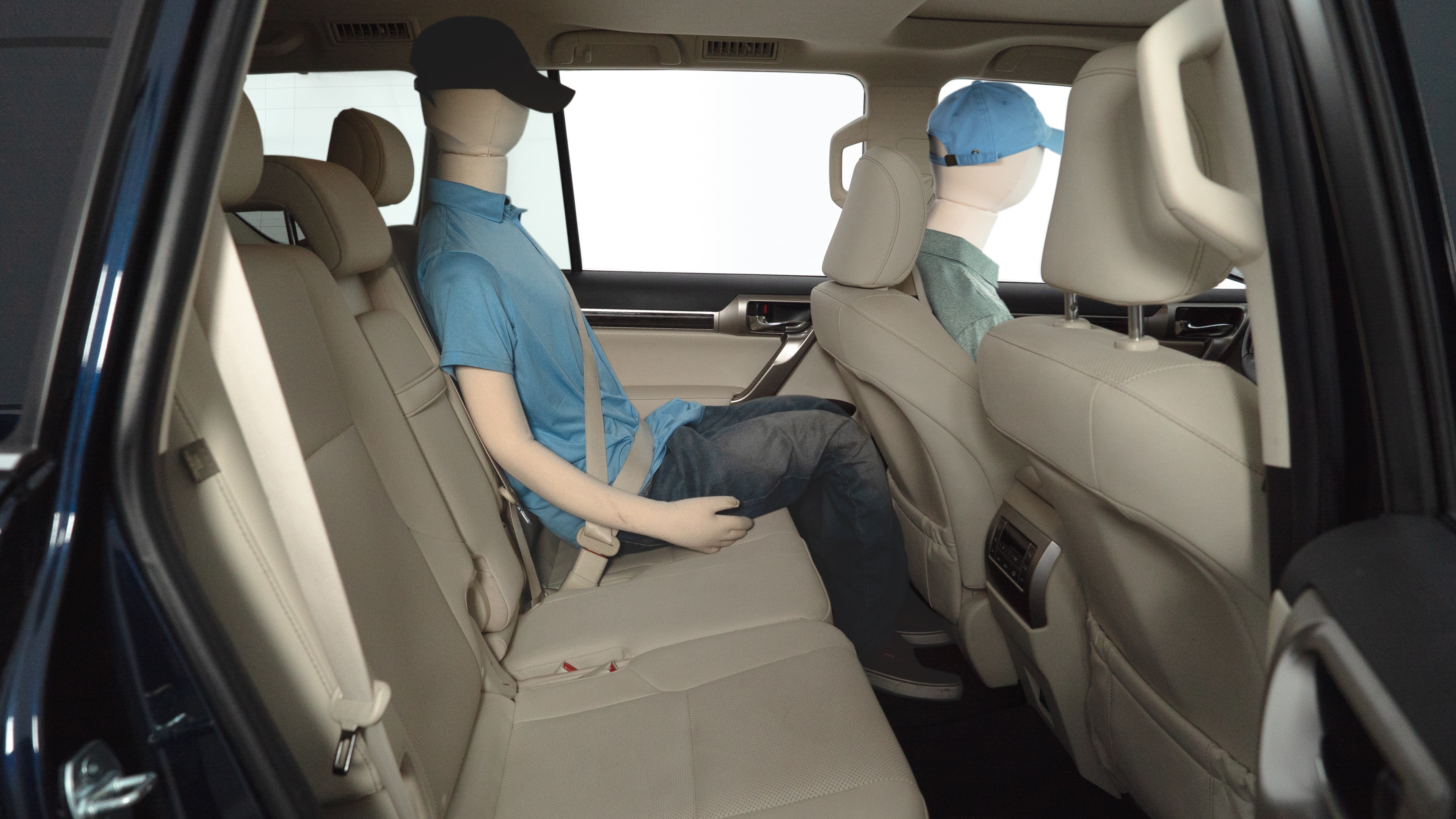 A series of second-row backseat photos is shown including one seating a baby seat and one seating a 6'1" mannequin.