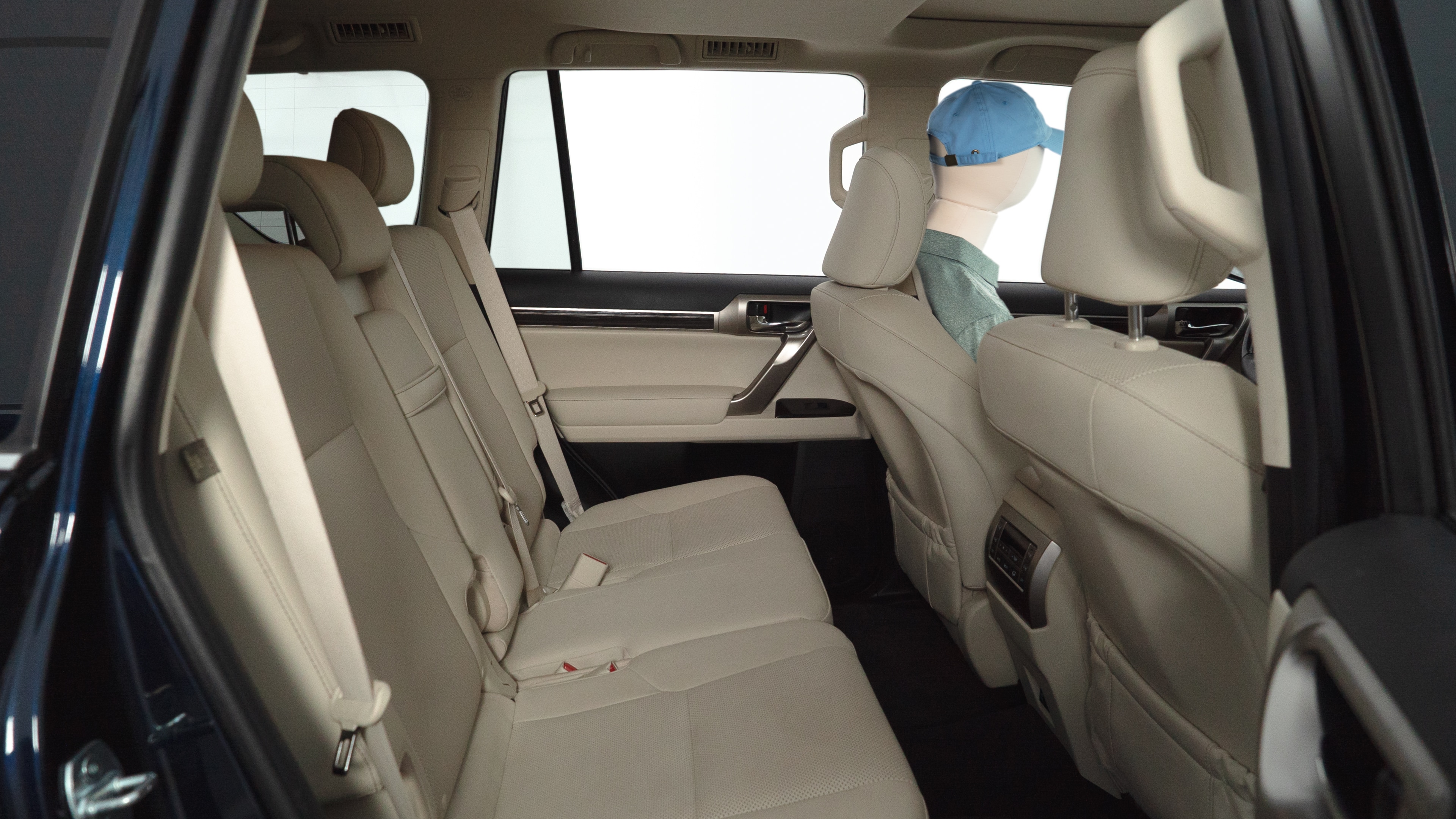A series of second-row backseat photos is shown including one seating a baby seat and one seating a 6'1" mannequin.