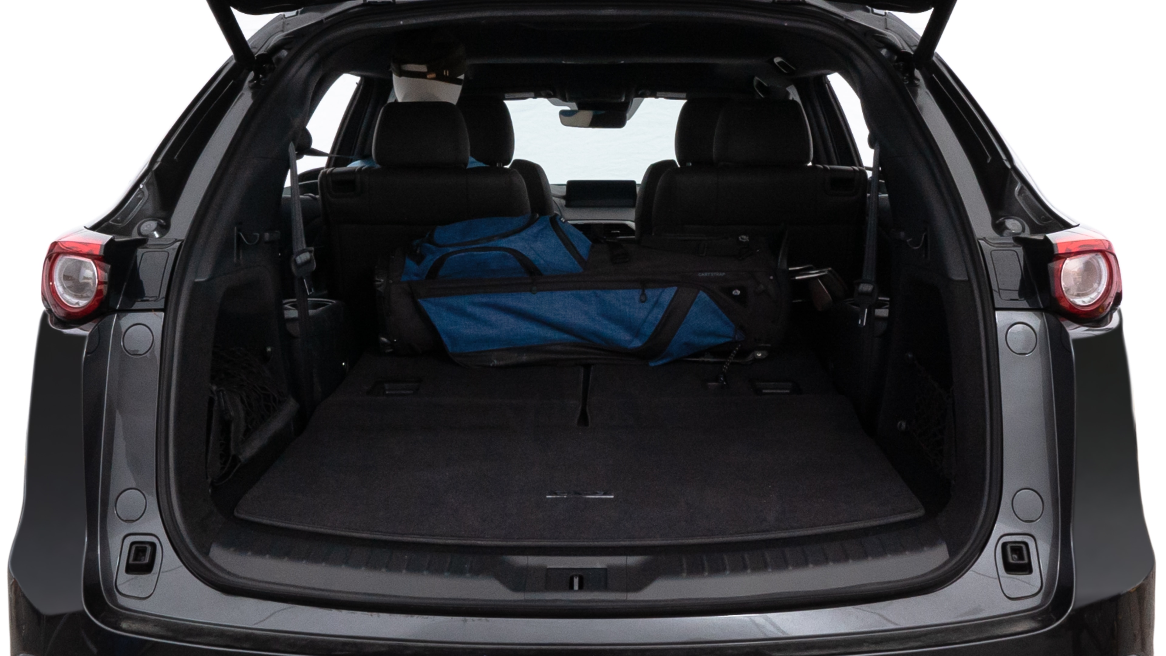 The trunk lid is open showing full view of the trunk. A baby stroller, three grocery carriers, two camping chairs in the carrying bag, and a set of golf clubs are placed inside.