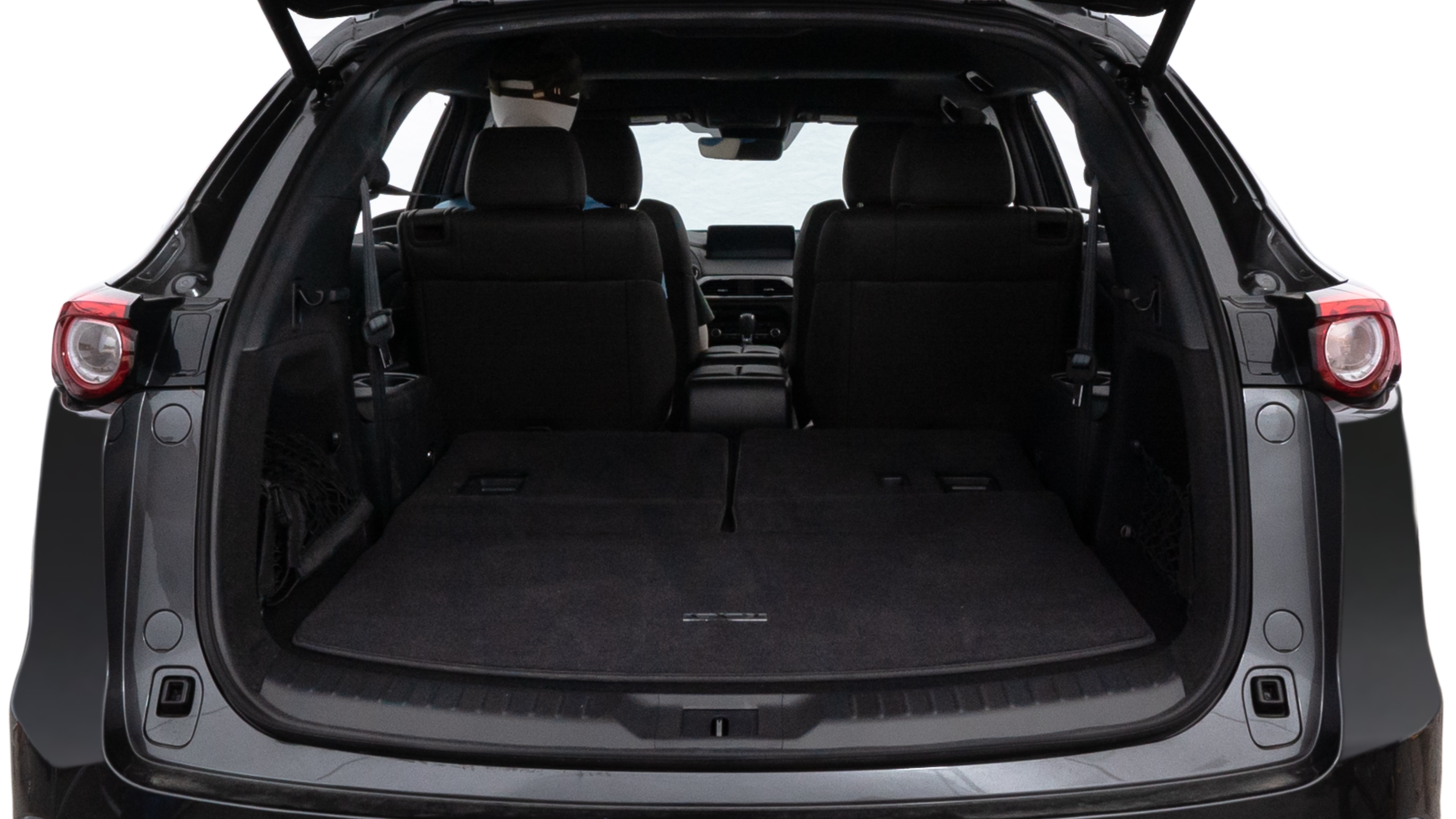 The trunk lid is open showing full view of the trunk. A baby stroller, three grocery carriers, two camping chairs in the carrying bag, and a set of golf clubs are placed inside.