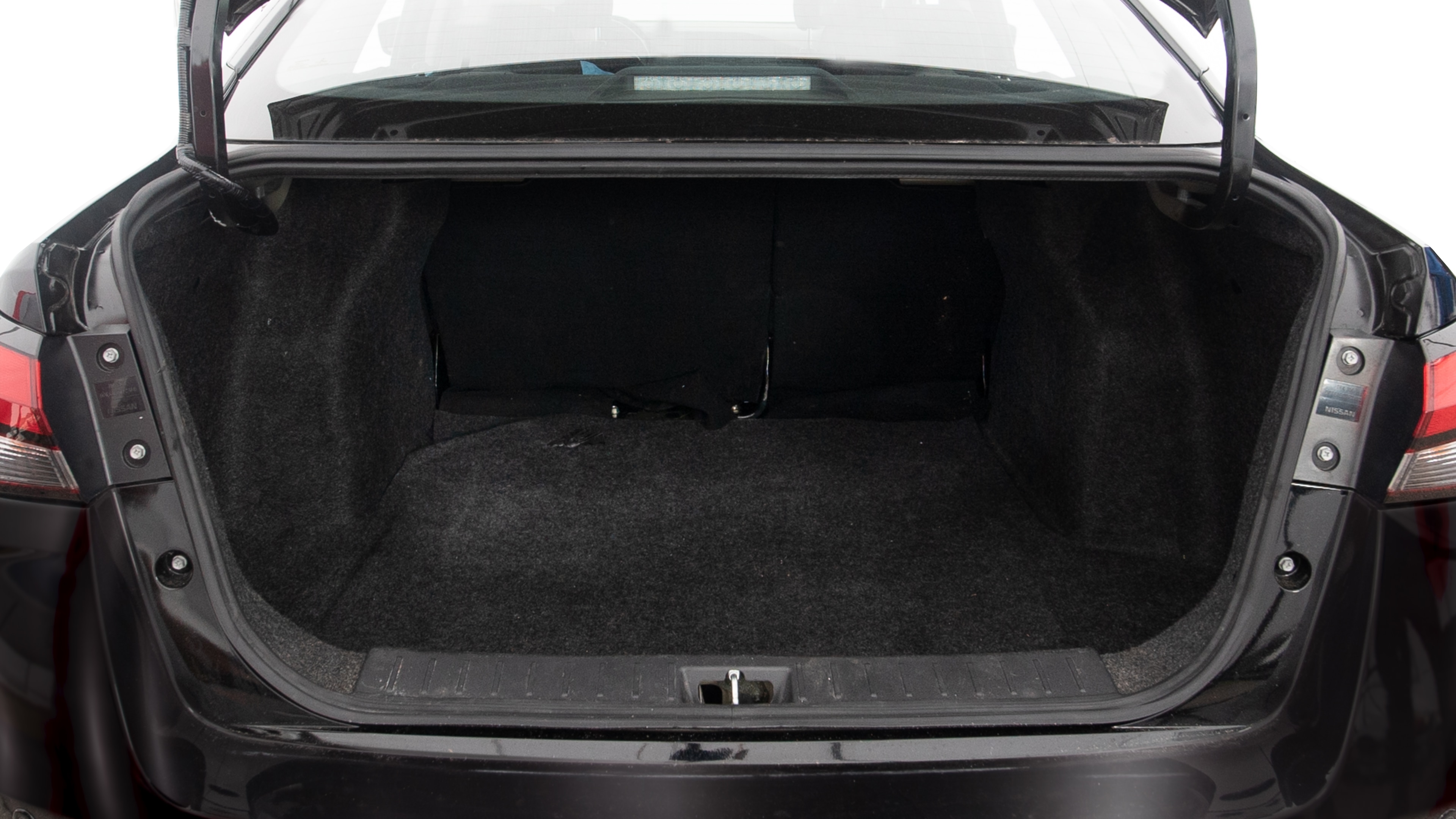 The trunk lid is open showing full view of the trunk. A baby stroller, three grocery carriers, two camping chairs in the carrying bag, and a set of golf clubs are placed inside.