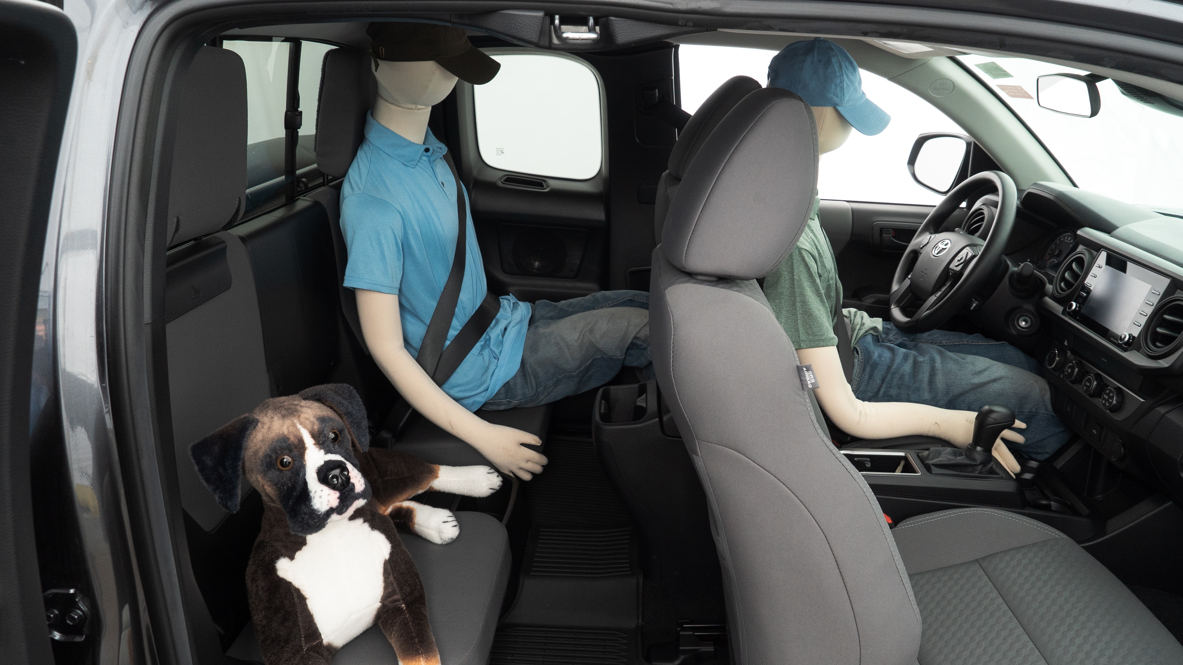 A series of second-row backseat photos is shown including one seating a baby seat and one seating a 6'1" mannequin.