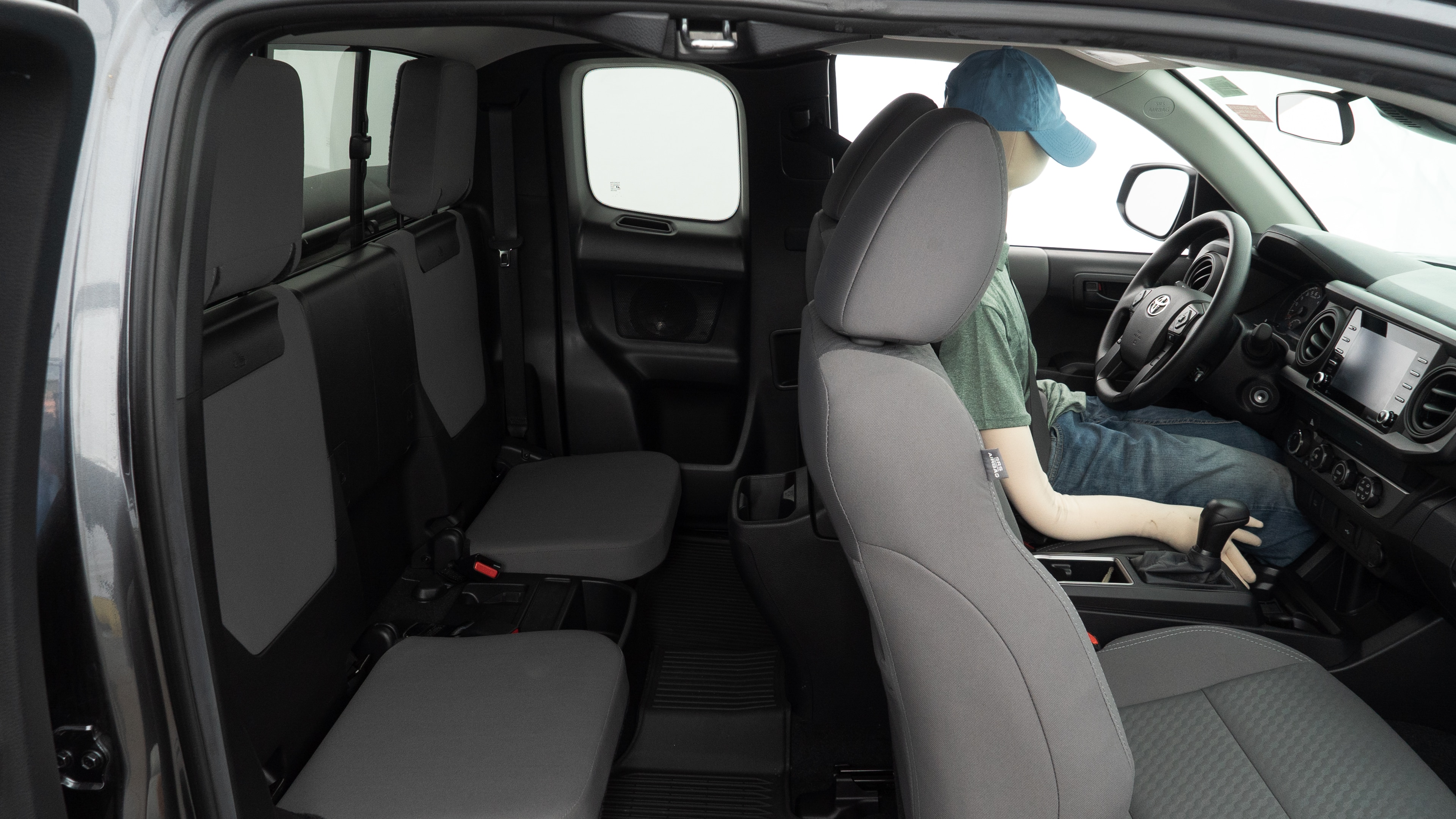 A series of second-row backseat photos is shown including one seating a baby seat and one seating a 6'1" mannequin.
