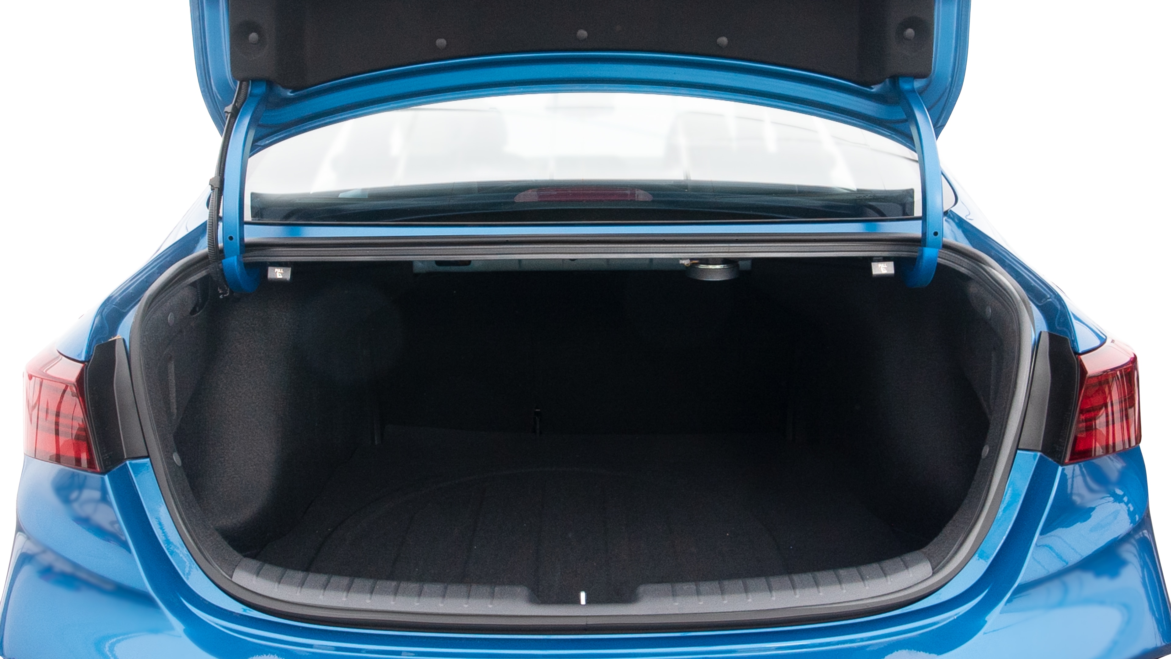 The trunk lid is open showing full view of the trunk. A baby stroller, three grocery carriers, two camping chairs in the carrying bag, and a set of golf clubs are placed inside.