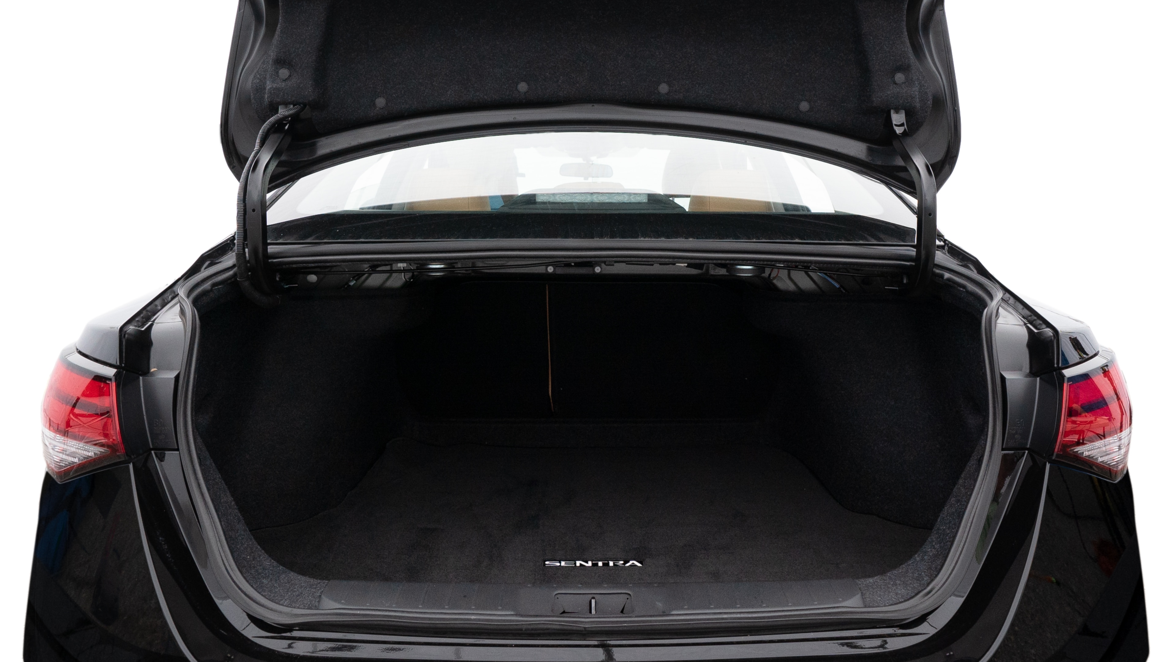 The trunk lid is open showing full view of the trunk. A baby stroller, three grocery carriers, two camping chairs in the carrying bag, and a set of golf clubs are placed inside.