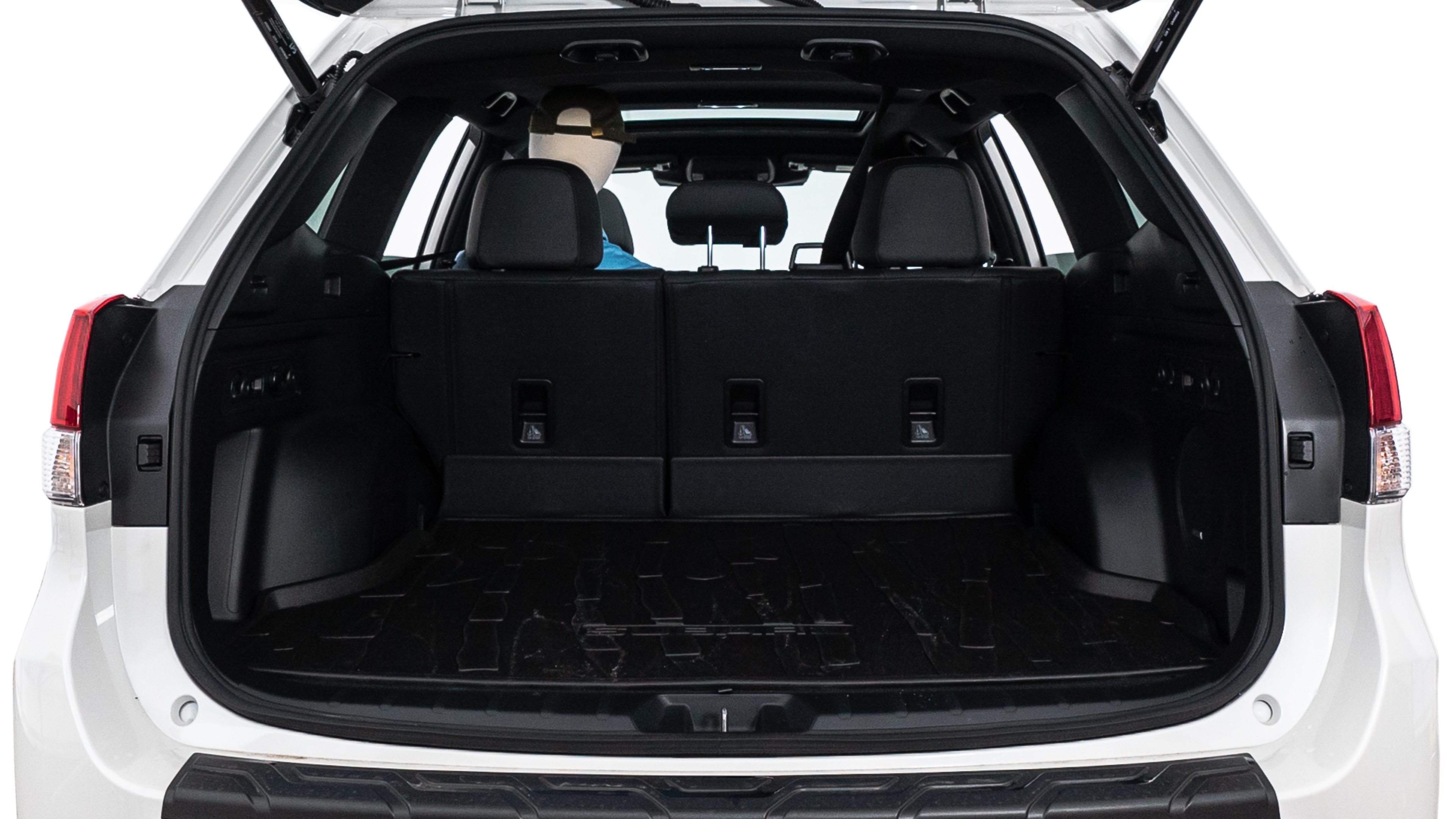 The trunk lid is open showing full view of the trunk. A baby stroller, three grocery carriers, two camping chairs in the carrying bag, and a set of golf clubs are placed inside.
