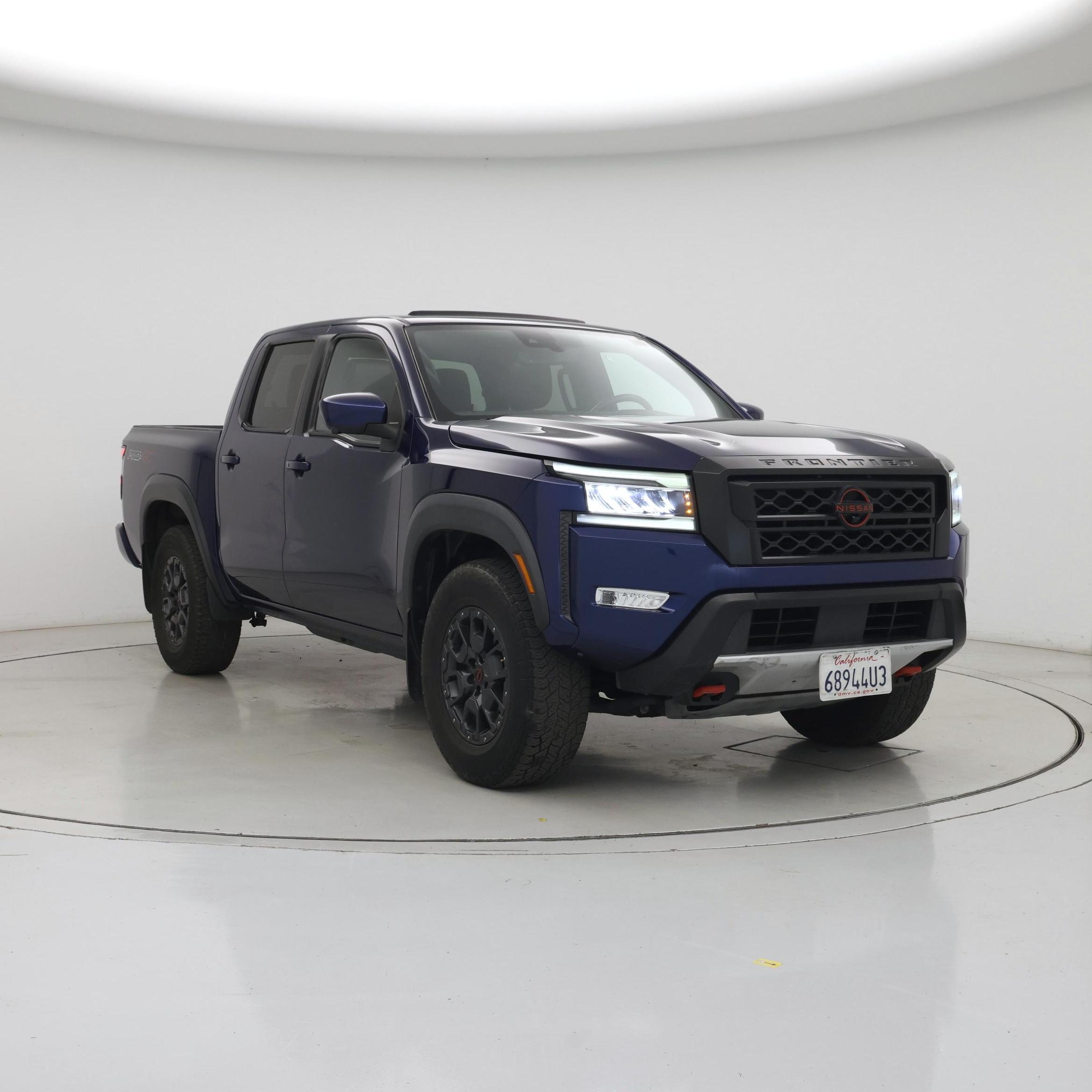 Blue 2023 Nissan Frontier Pickup Truck Four-Wheel Drive Automatic